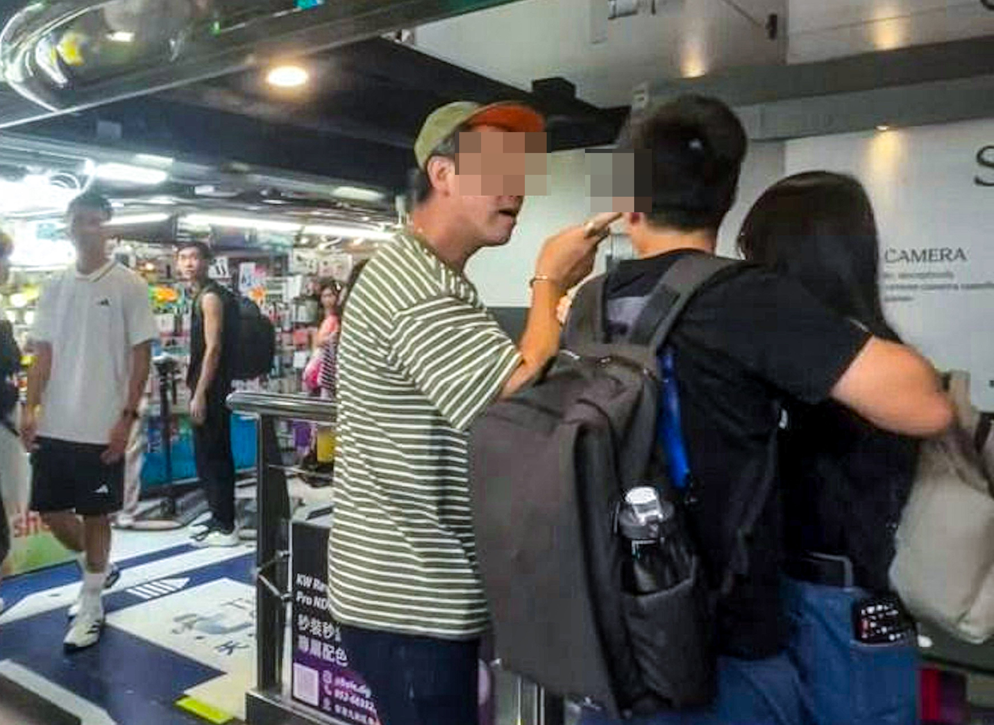 A screen grab of the suspect berating a younger couple at Sim City shopping centre in Mong Kok. Photo: Handout