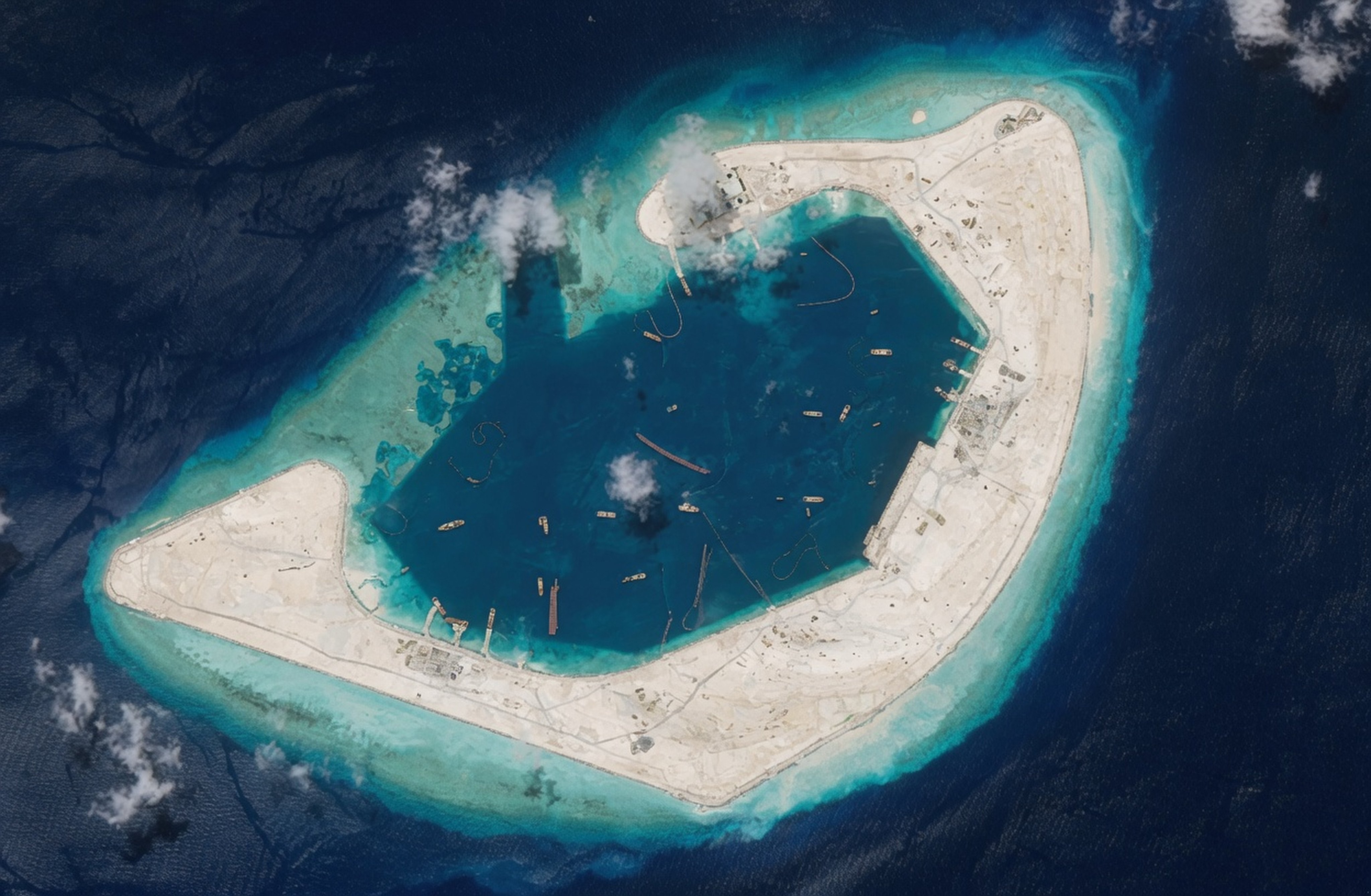 New satellite images show China has built a long, reinforced quay on Antelope Reef’s lagoon. Photo: EU