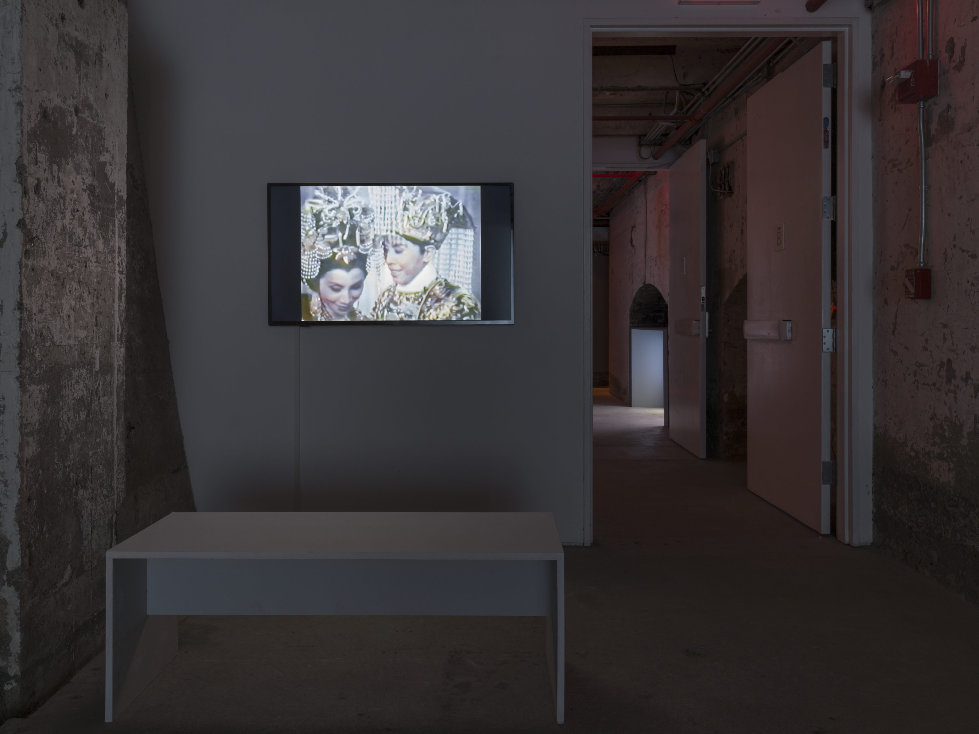 An installation view of Pau’s solo exhibition “She Moves” at New York’s SculptureCenter. On the wall is the video Song of the Goddess (1992), with footages of Cantonese opera duo Yam Kim-fai and Pak Suet-sin. Photo: Charles Benton