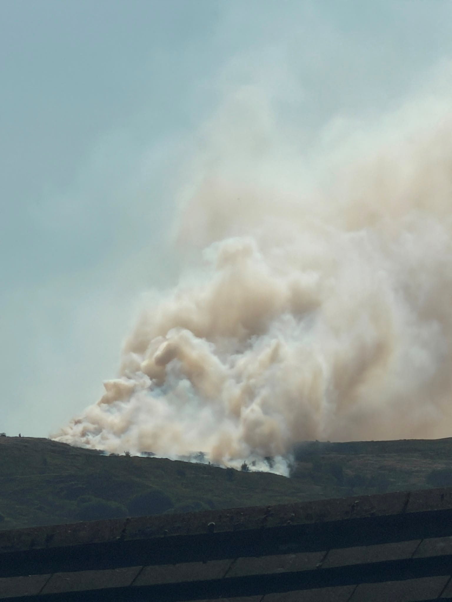 Smoke rises as a wildfire burns in Darwen, Britain, on Sunday. Photo: Andrew Robinson via Reuters