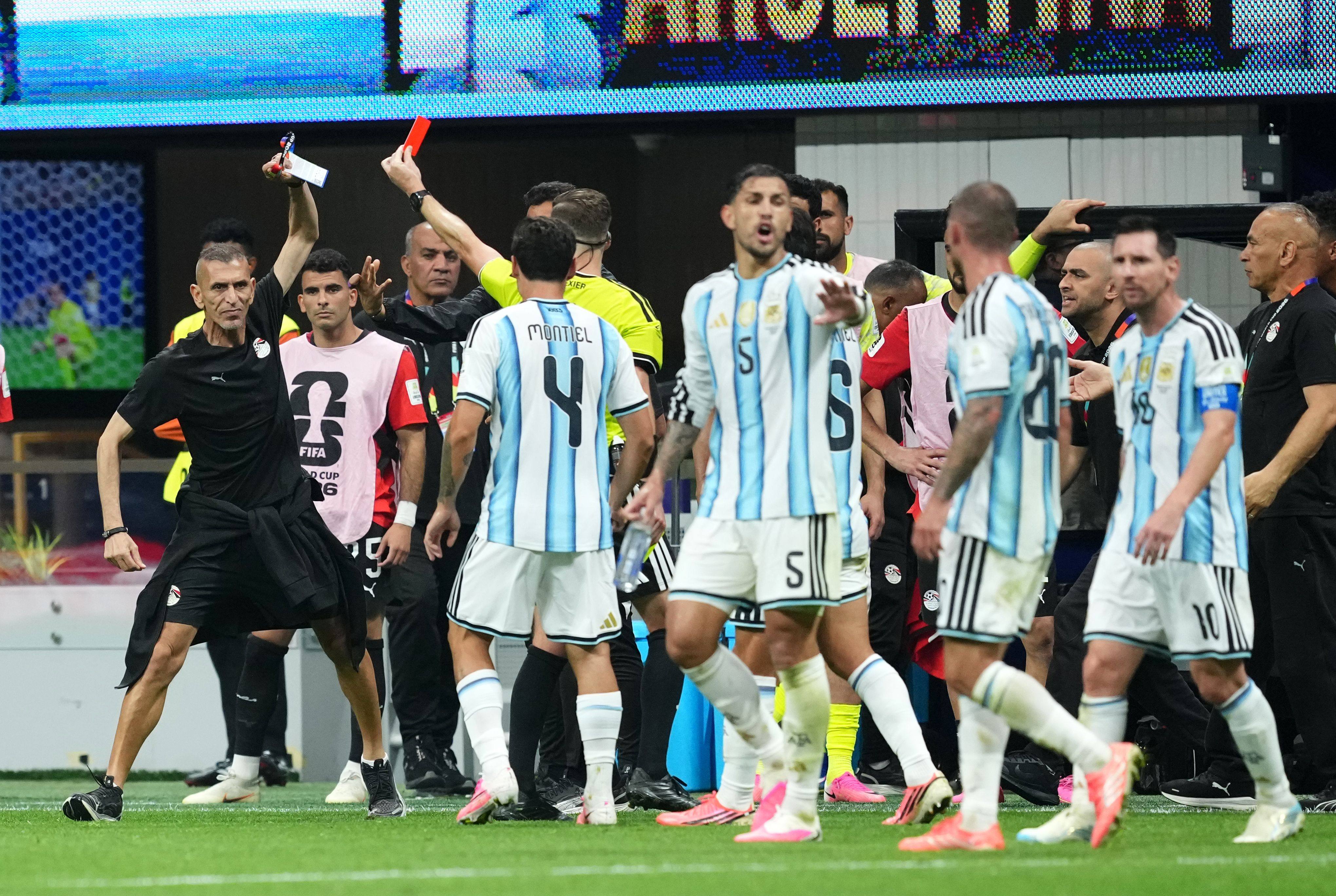 A flashpoint in the controversial Argentina v Egypt match, when referee Francois Letexier shows a red card to an Egyptian staff member. Photo: dpa