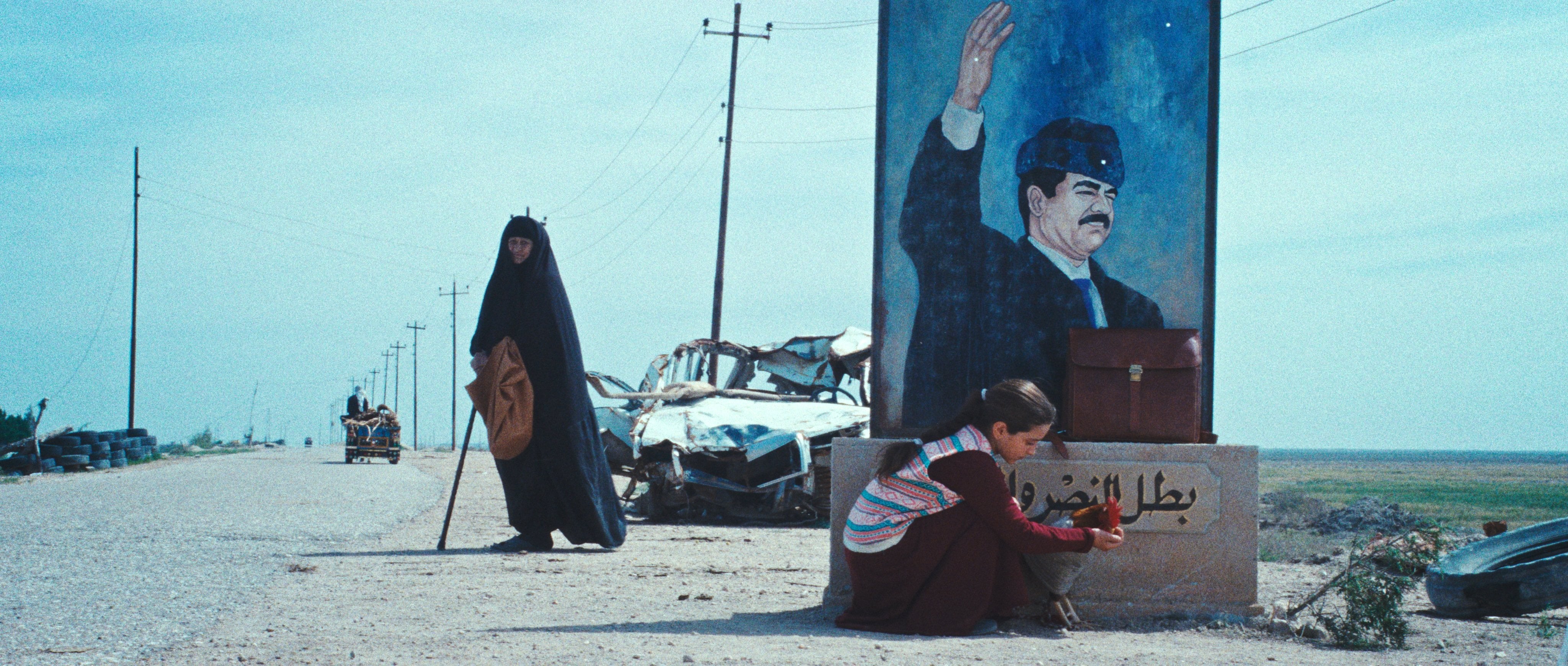 Baneen Ahmad Nayyef (kneeling) in a still from The President’s Cake (category IIA, Arabic), directed by Hasan Hadi. Waheed Thabet Khreibat and Sajad Mohamad Qasem co-star.