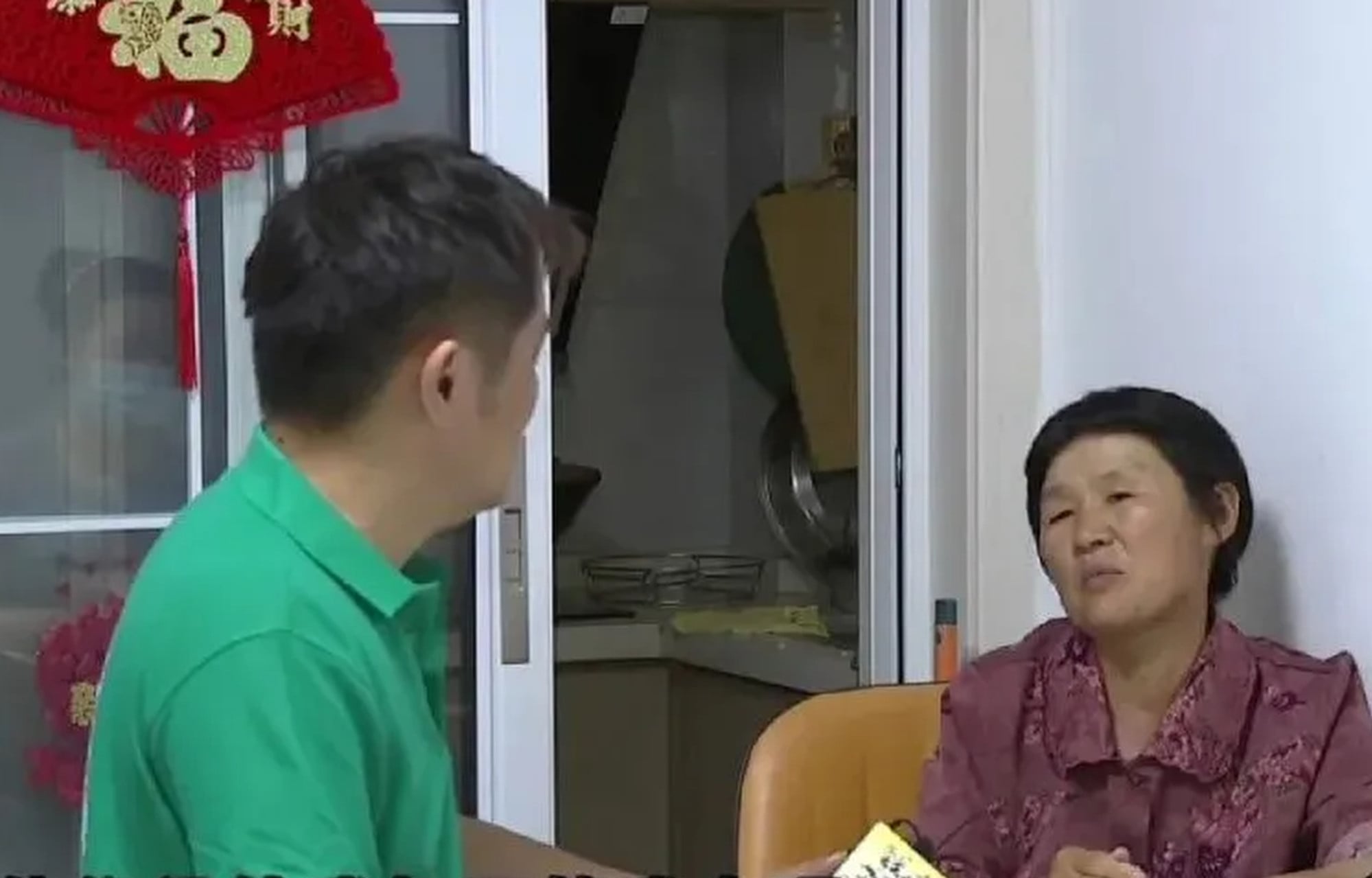 The family feud has fuelled a heated online debate over childcare and filial obligations after the grandmother (above) and her son were interviewed by a reporter. Photo: QQ.com The family feud has fuelled a heated online debate over childcare and filial obligations after the grandmother (above) and her son were interviewed by a reporter. Photo: QQ.com