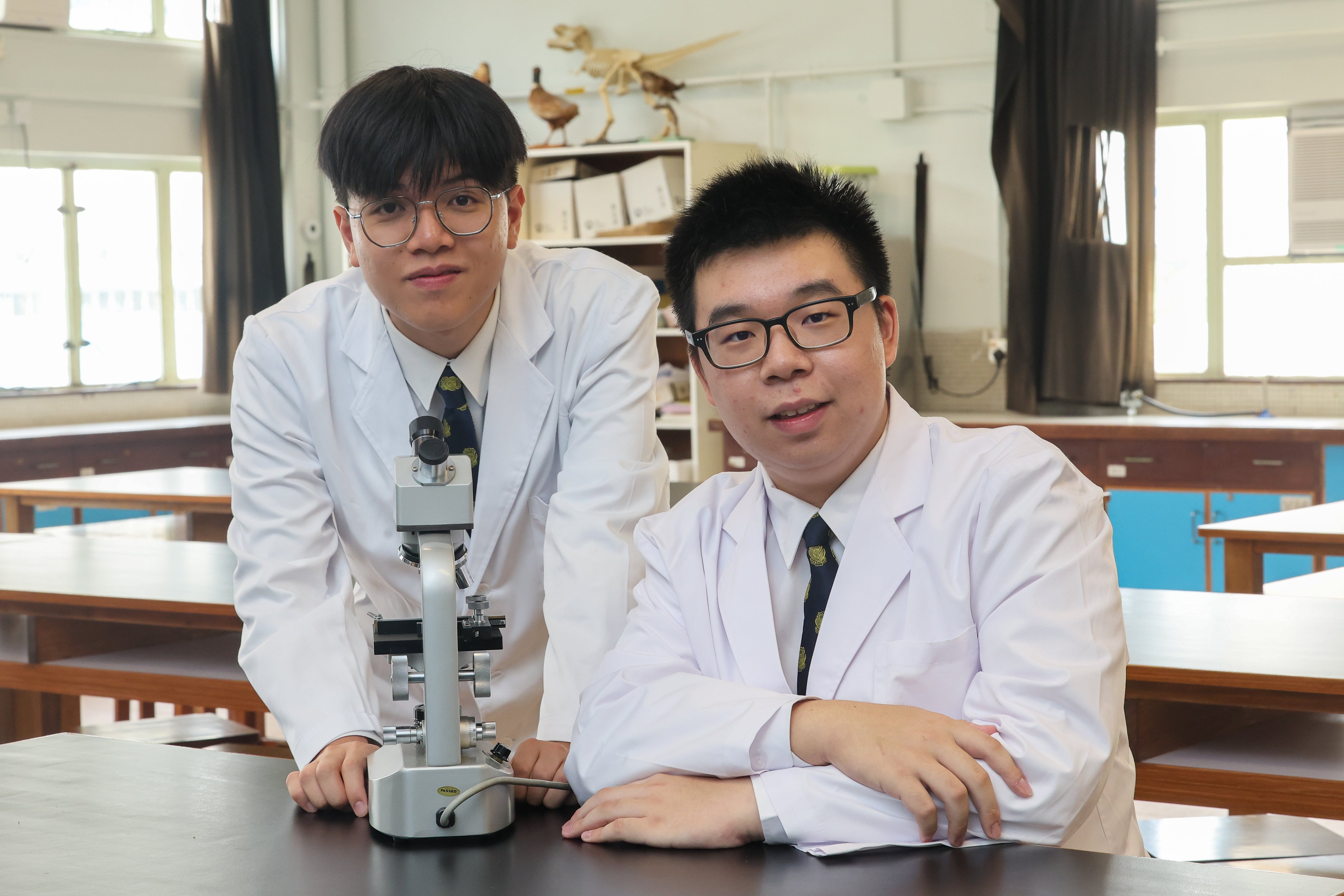 Joe Lai Yat-long (left) and Louis Fong Lok-man have graduated from Po Leung Kuk Centenary Li Shiu Chung Memorial College in Tuen Mun. Photo: Edmond So