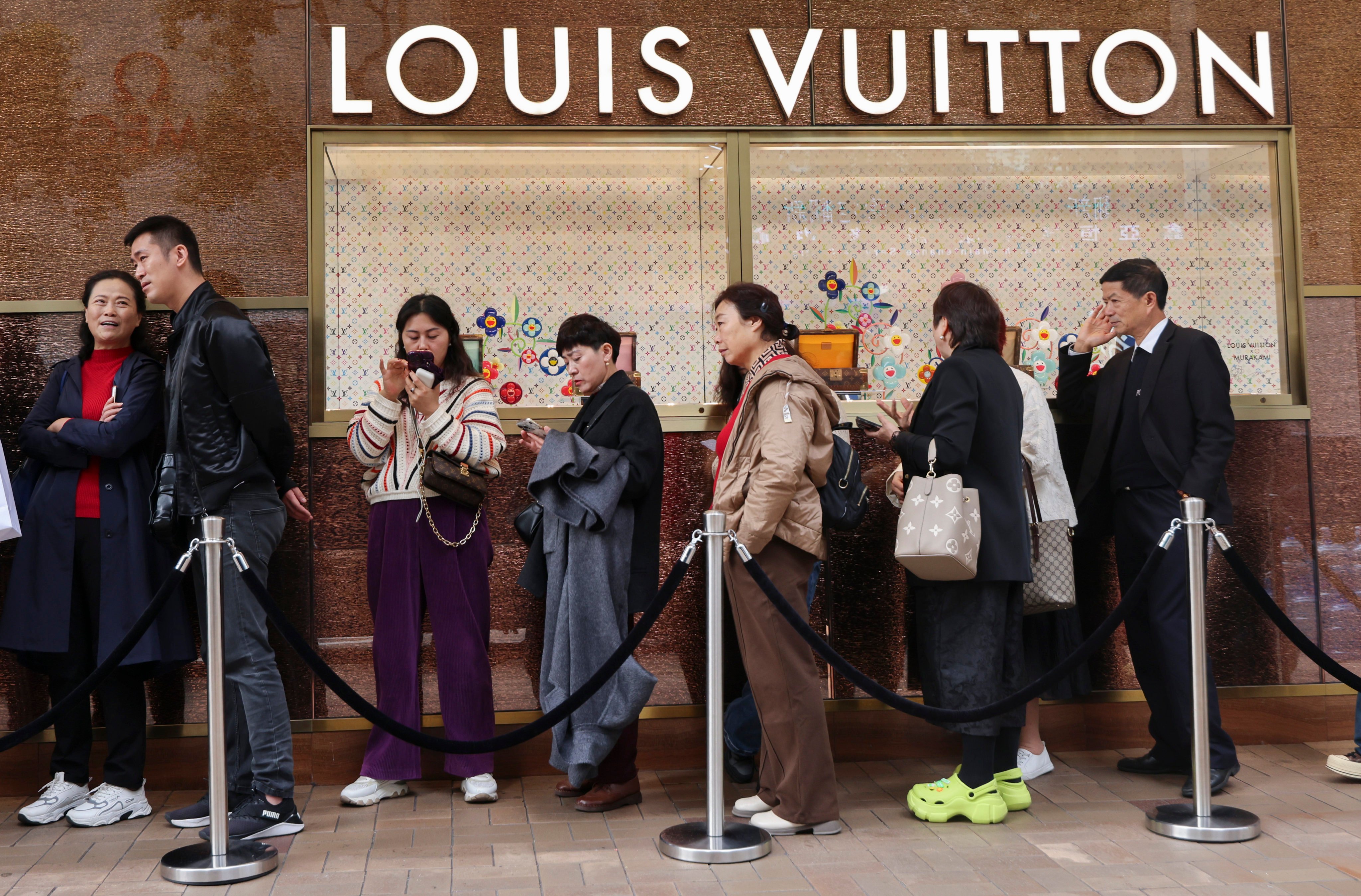 Shoppers queue up at a Louis Vuitton store in Hong Kong. Photo: SCMP