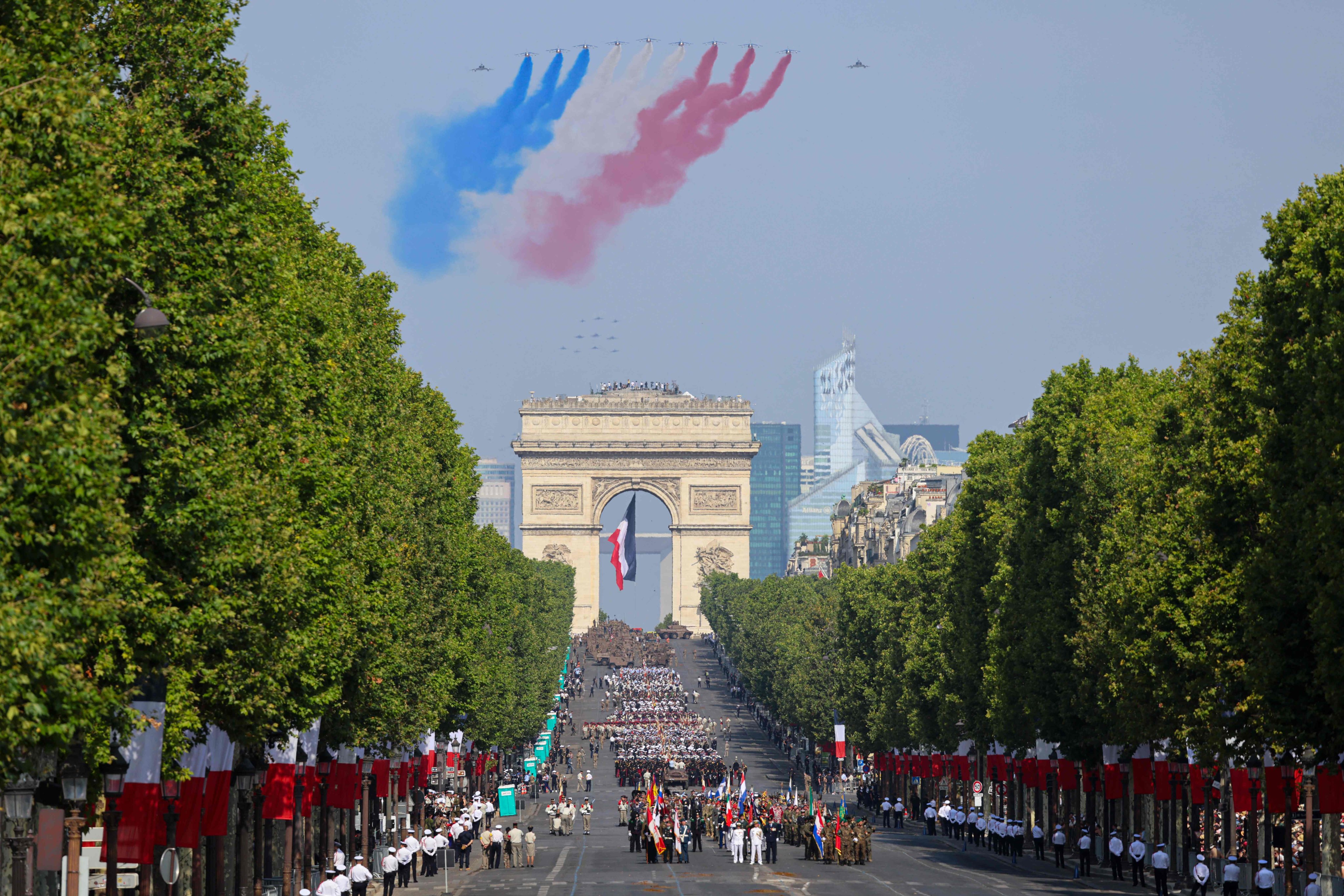 France’s Air Force Elite aerobatic flying team perform a flyover in Paris. Photo: AFP