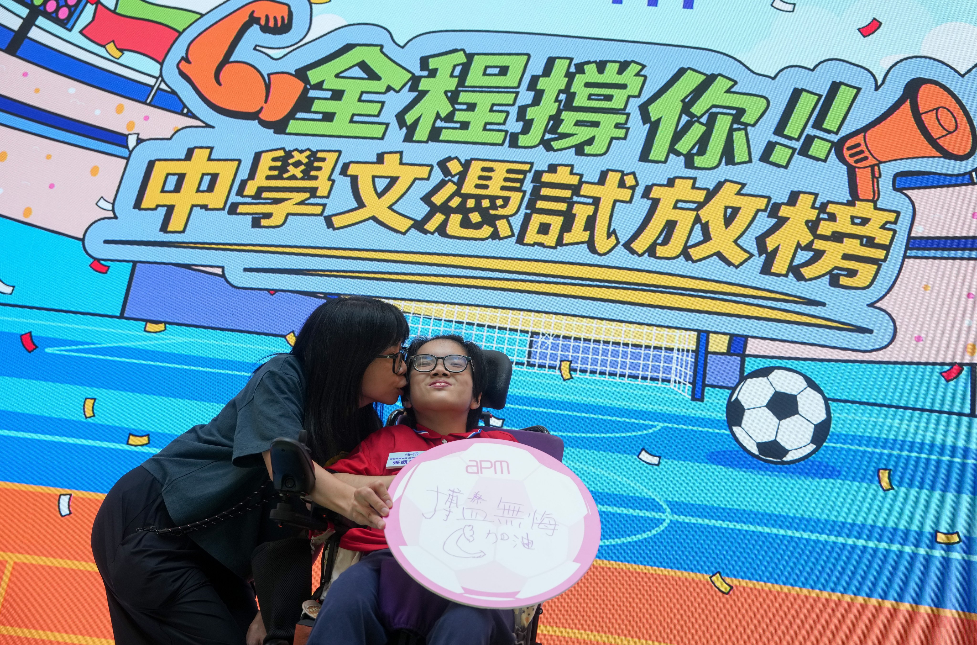 A mother and daughter attend an event organised by a Hong Kong mall to cheer on students receiving their Diploma of Secondary Education exam results this year, on July 14, a day before results release day. Photo: Sam Tsang