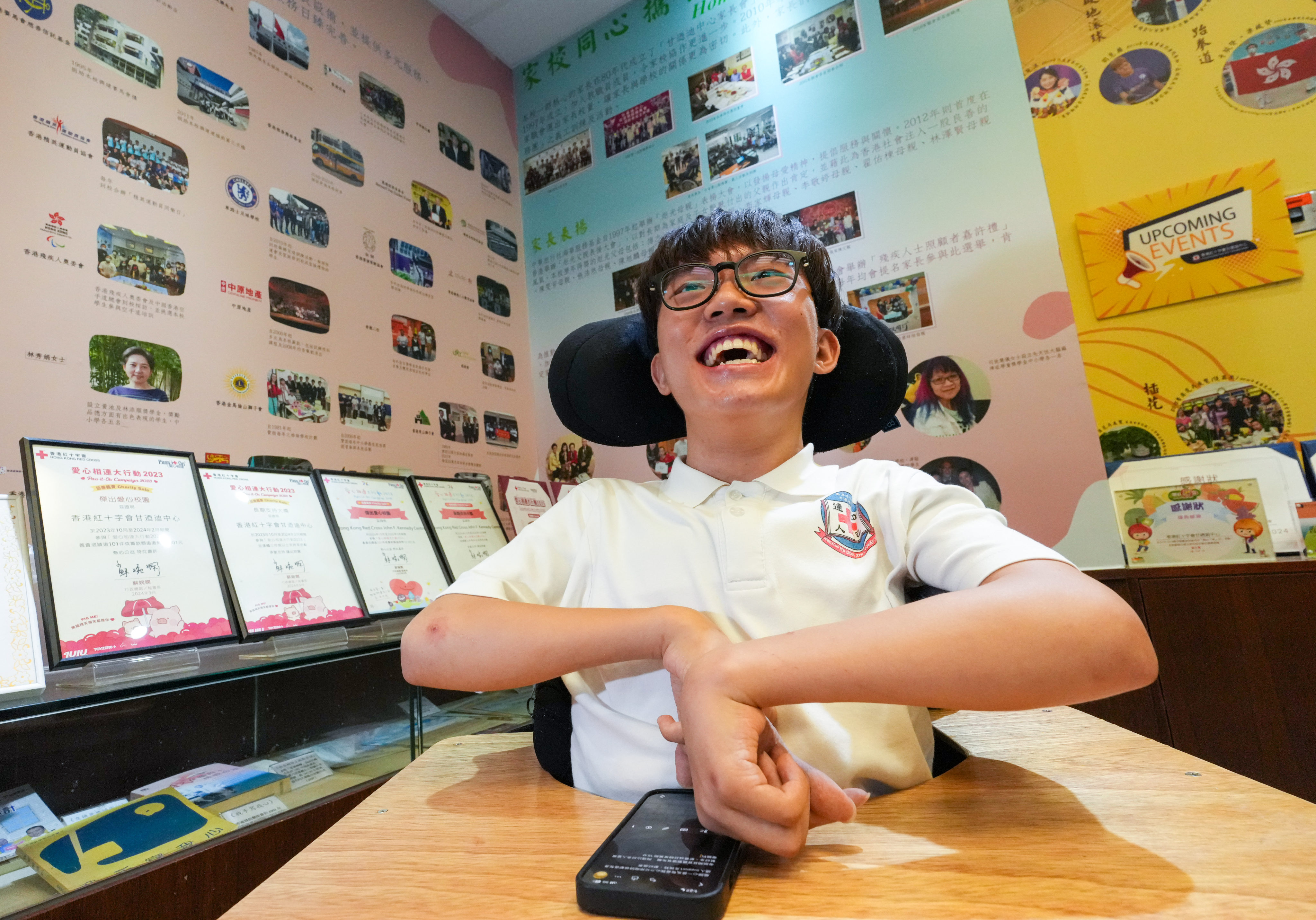 Tam Chun-yu, who has cerebral palsy, typed his answers with one finger while Liu Pong-faat has difficulty writing but completed his exams. 