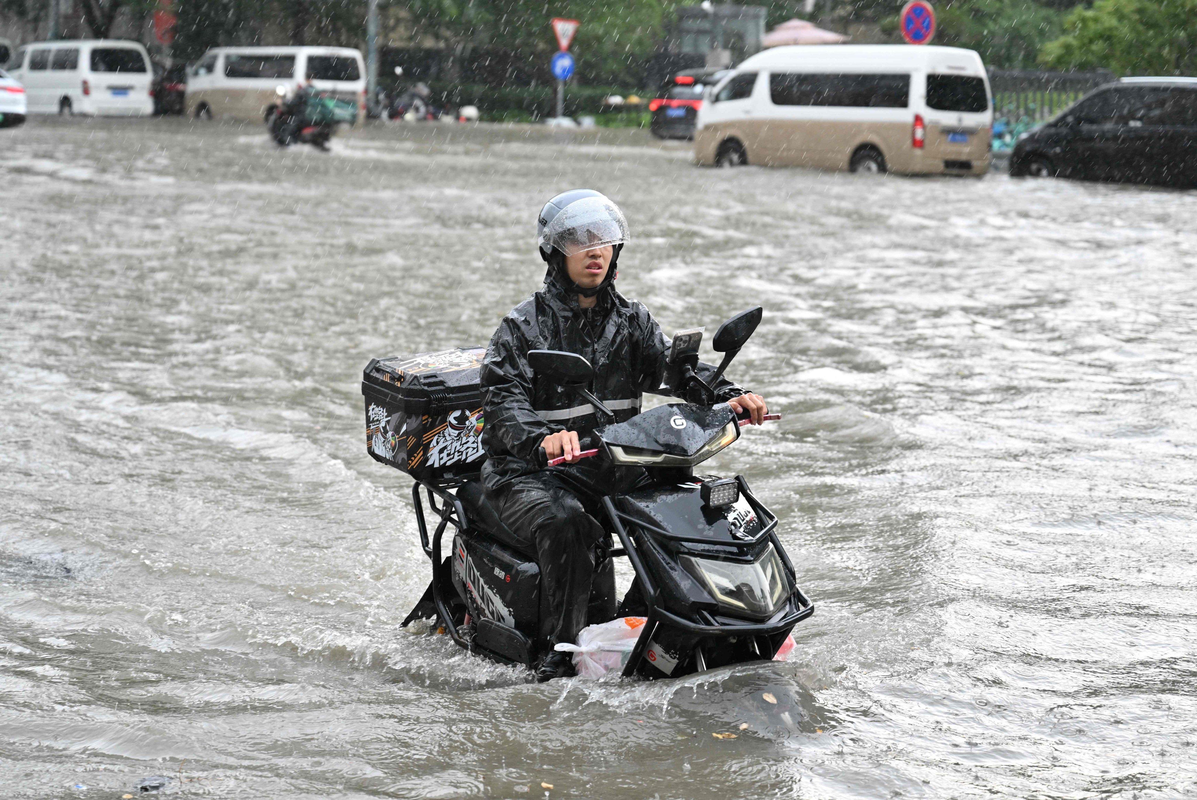 This month, large parts of China have been inundated by a pair of typhoons which have killed dozens and damaged crops and infrastructure. Photo: AFP