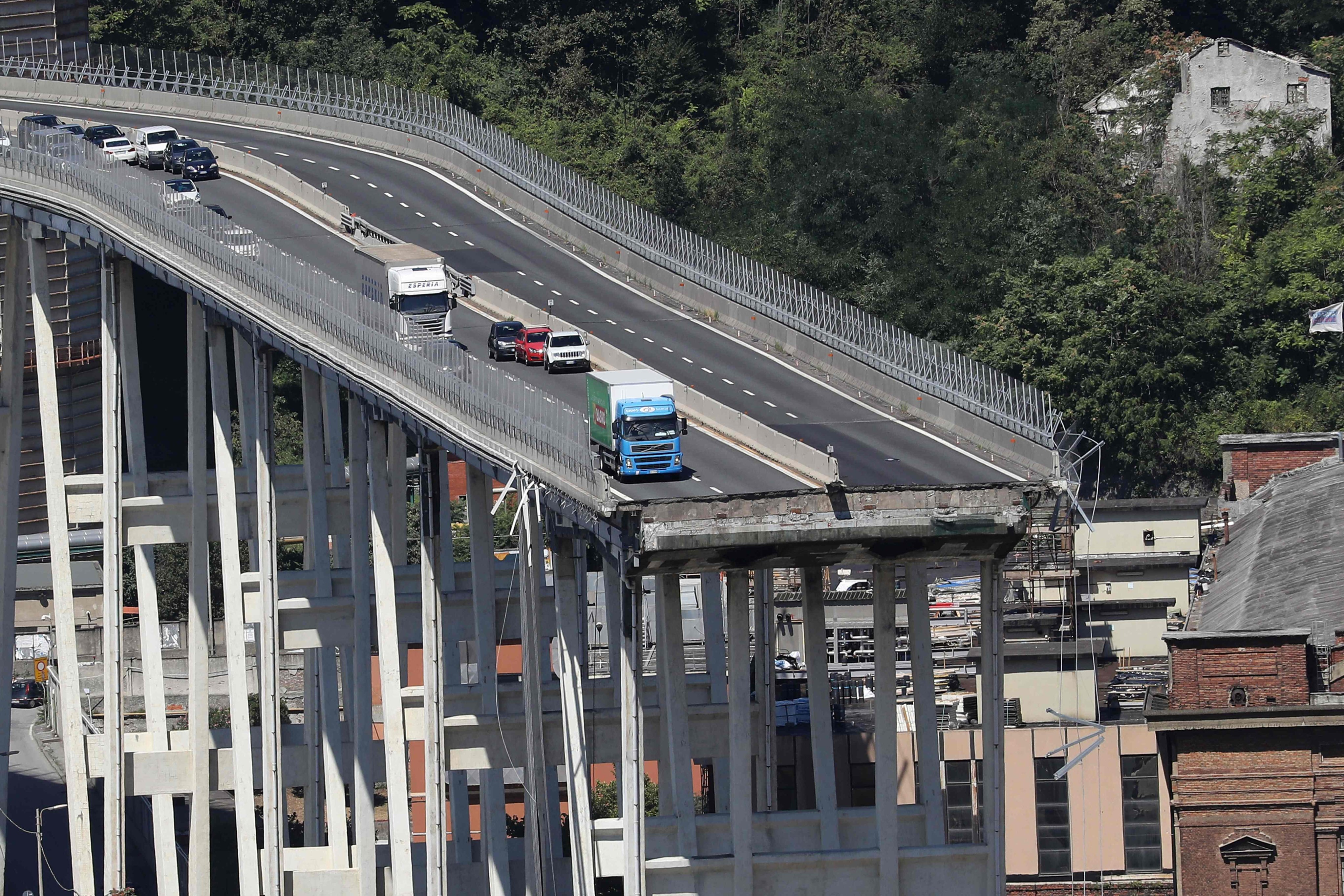 Vehicles are abandoned on the Morandi motorway bridge after a section collapsed in the north-western Italian city of Genoa in August 2018. Photo: AFP