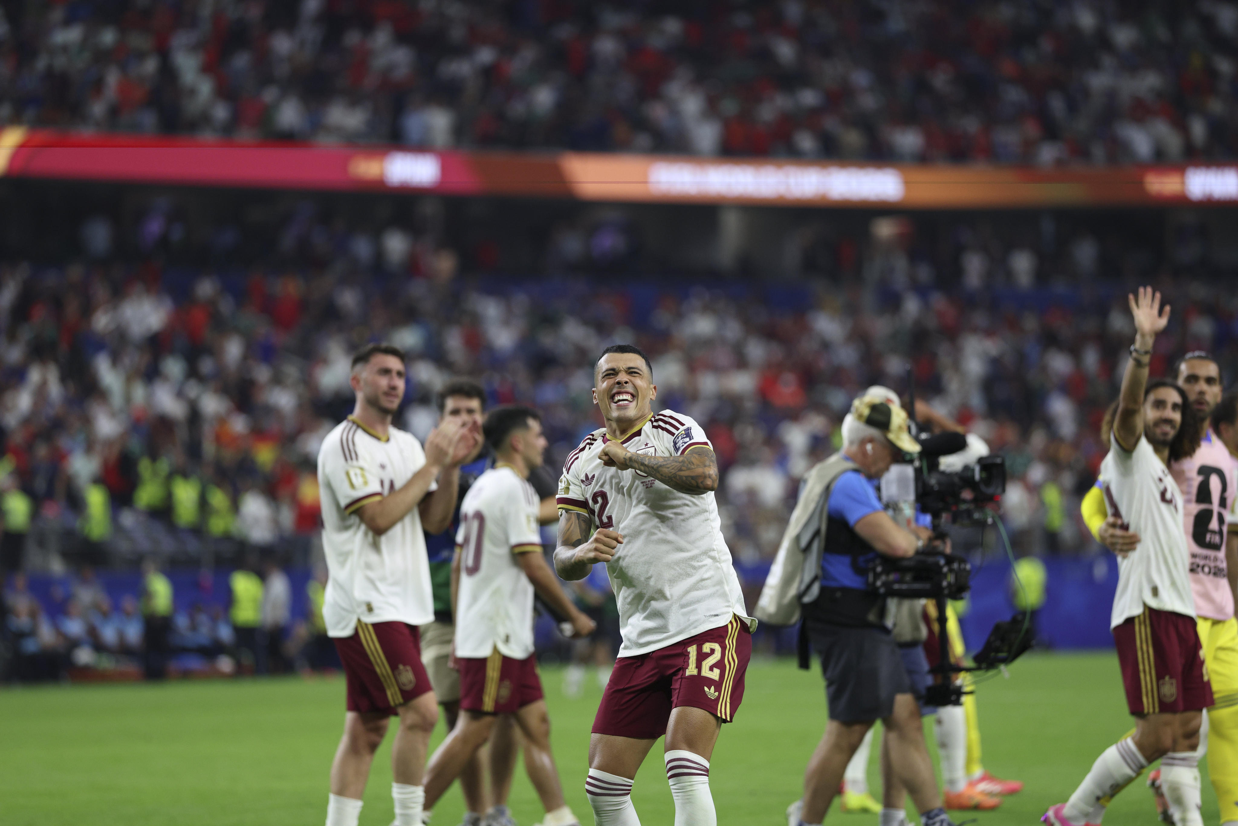 Pedro Porro (front) leads the celebrations after Spain's win over France in the first semi-final of the World Cup on Tuesday. Photo: Xinhua