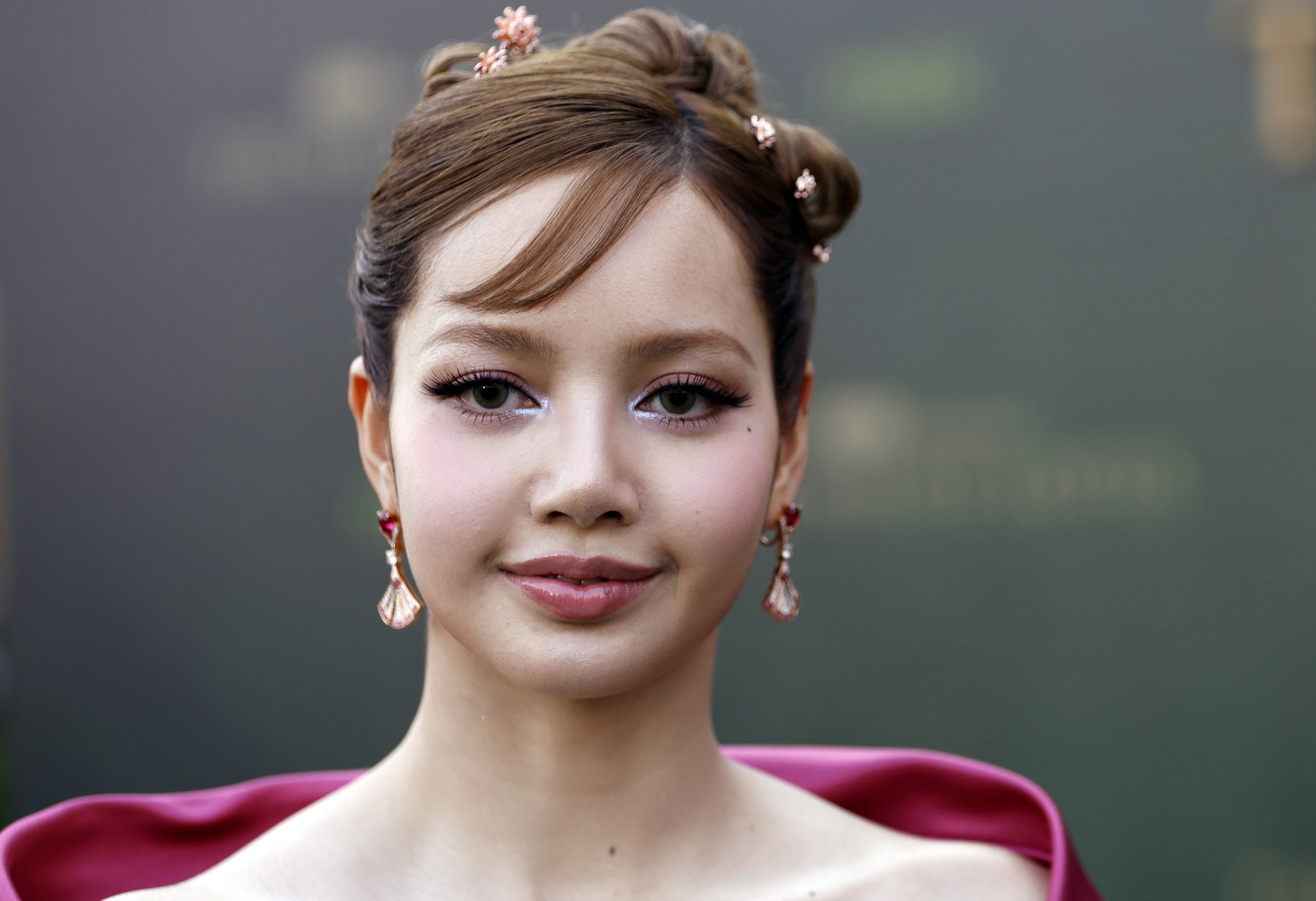 Blackpink’s Lisa was pretty in pink and a Y2K-inflected updo, accessorised with jewellery including tiny lotus flower hair embellishments, at the premiere of The White Lotus season three in Bangkok last year. Photo: EPA-EFE