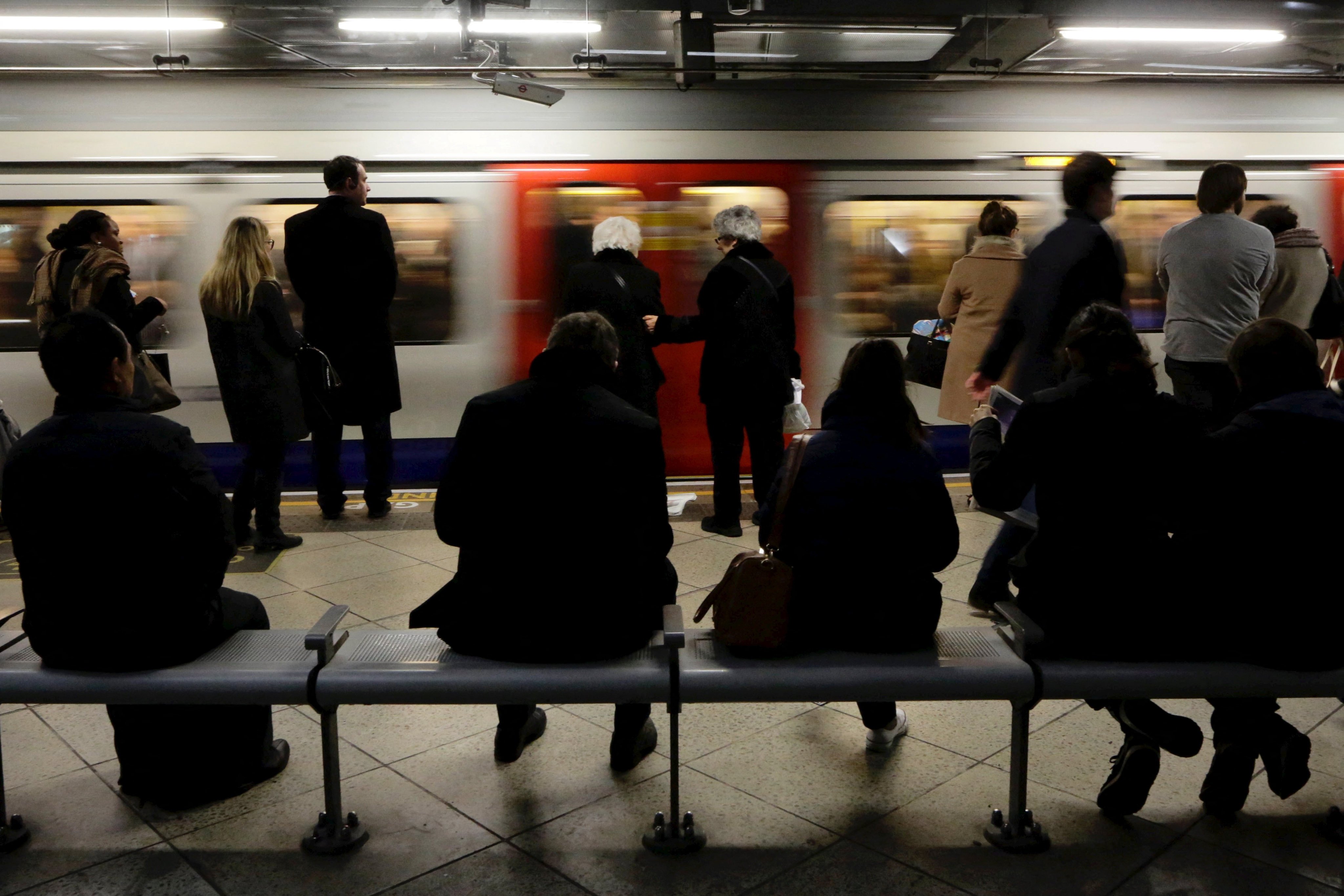 People wait for trains at Westminster Tube station in London. Photo: Reuters