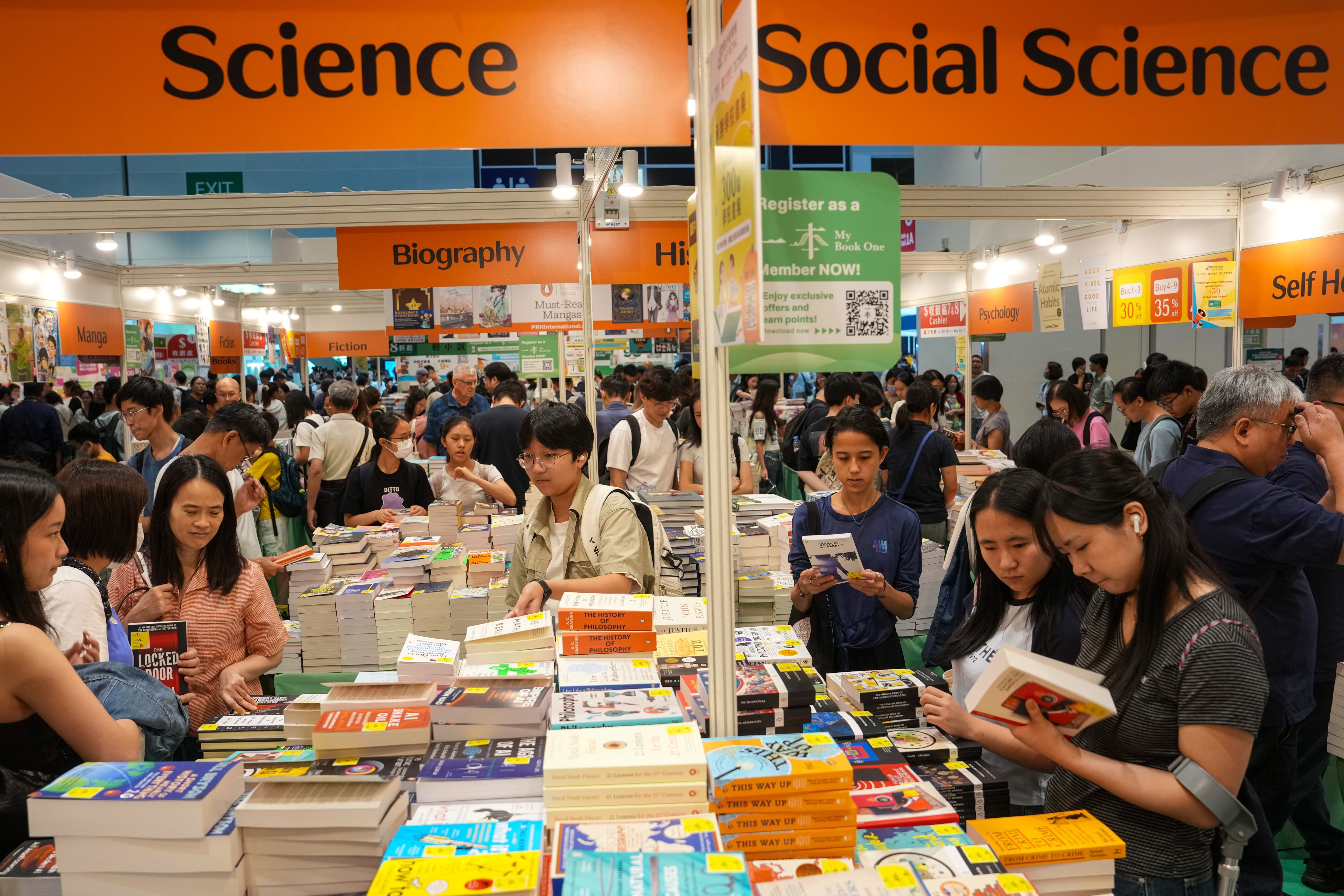 Visitors browse books on July 15, 2026, the first day of the Hong Kong Book Fair at the Hong Kong Convention and Exhibition Centre in Wan Chai. Photo: Sam Tsang