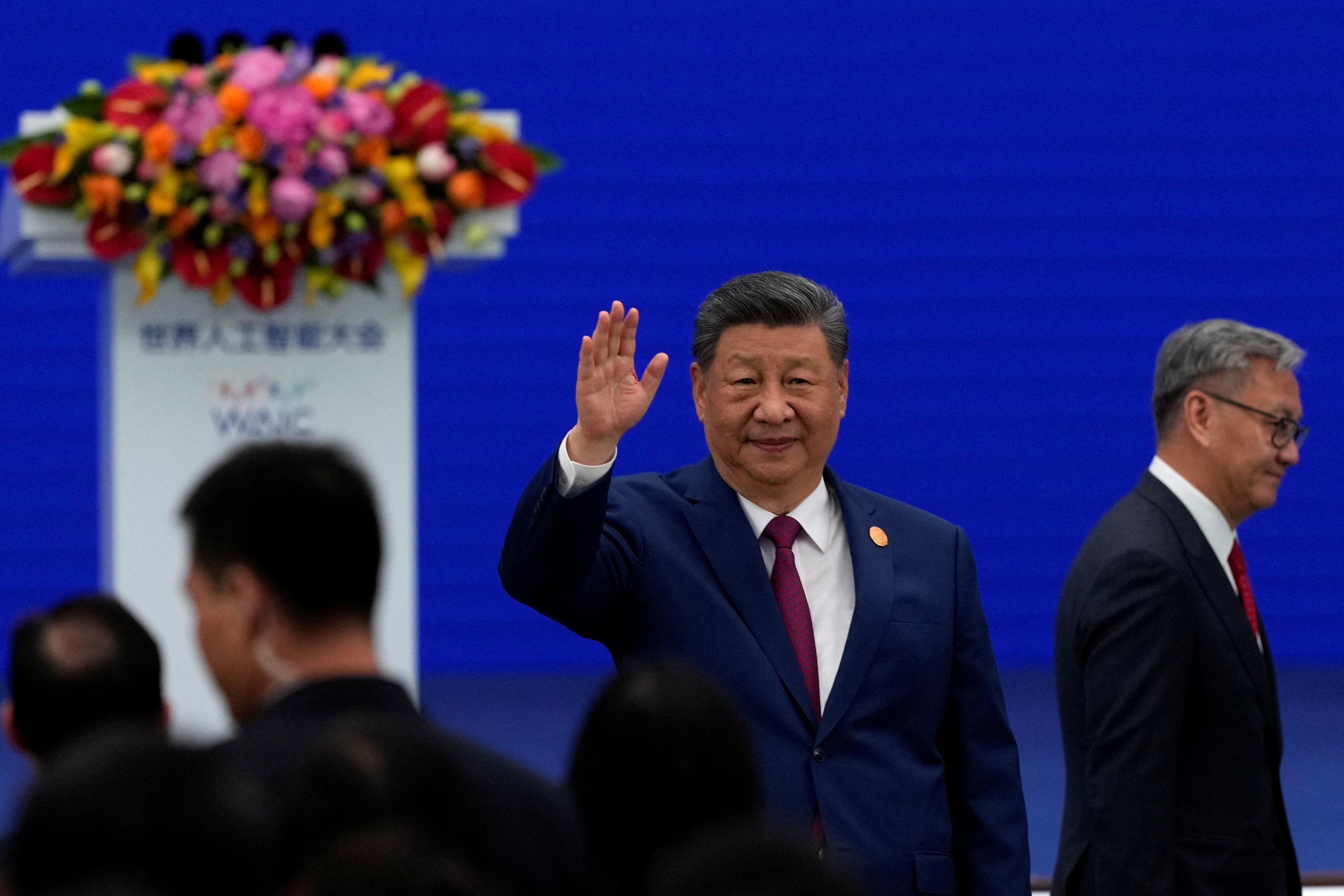 Chinese President Xi Jinping waves as he arrives at the opening ceremony for the World AI Conference in Shanghai, China, July 17, 2026.     Ng Han Guan/Pool via REUTERS