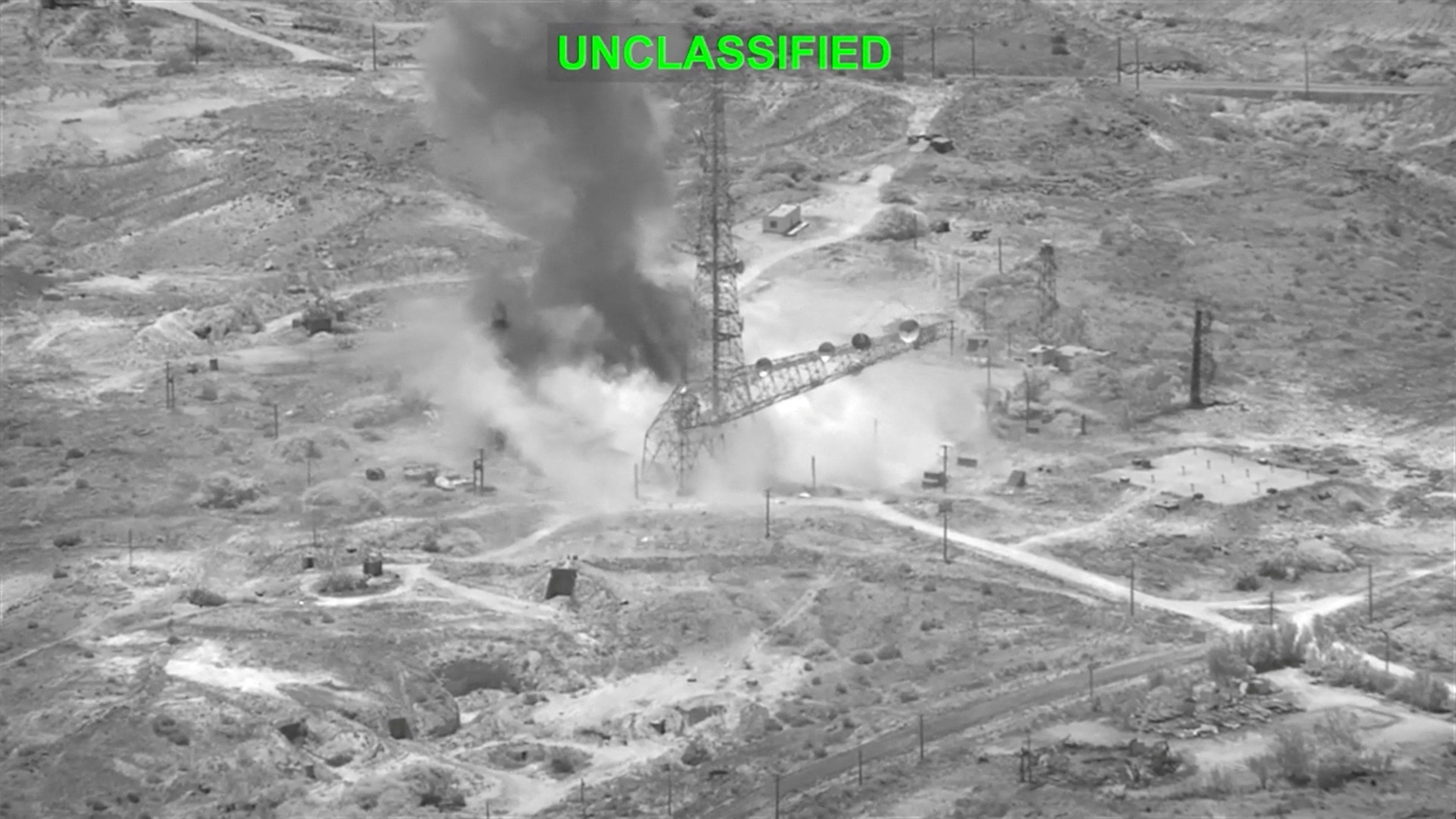Smoke rises from an explosion at an unknown location, during what US Central Command says are strikes on Iran. Image: US CENTCOM via Reuter