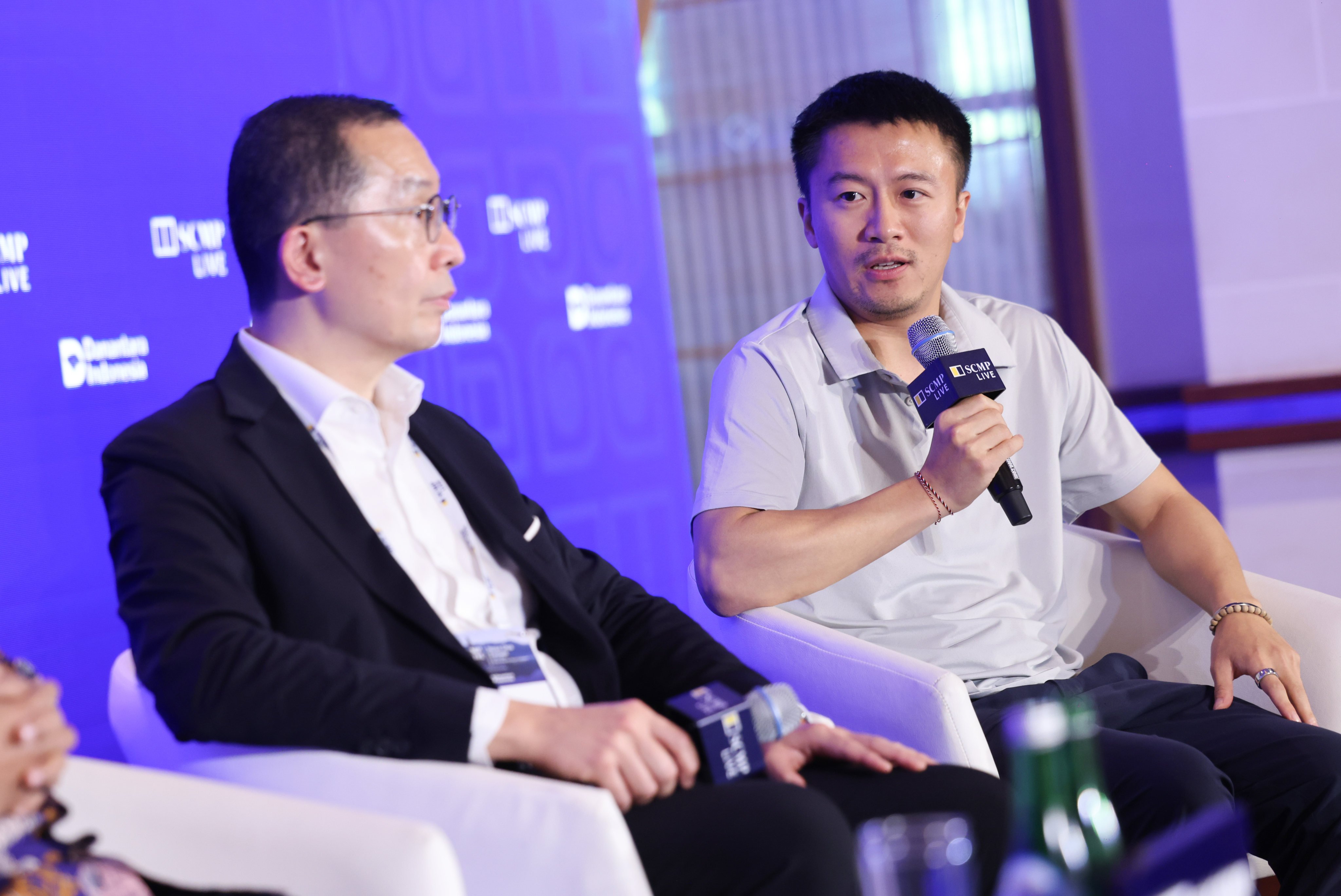 Zhou Yuxiang (right), founder and CEO of Black Lake Technologies, and Edmund Lee, general manager of Gold Peak Technology, speaking at the Nusa Dua Forum in Bali on Friday. Photo: Nora Tam