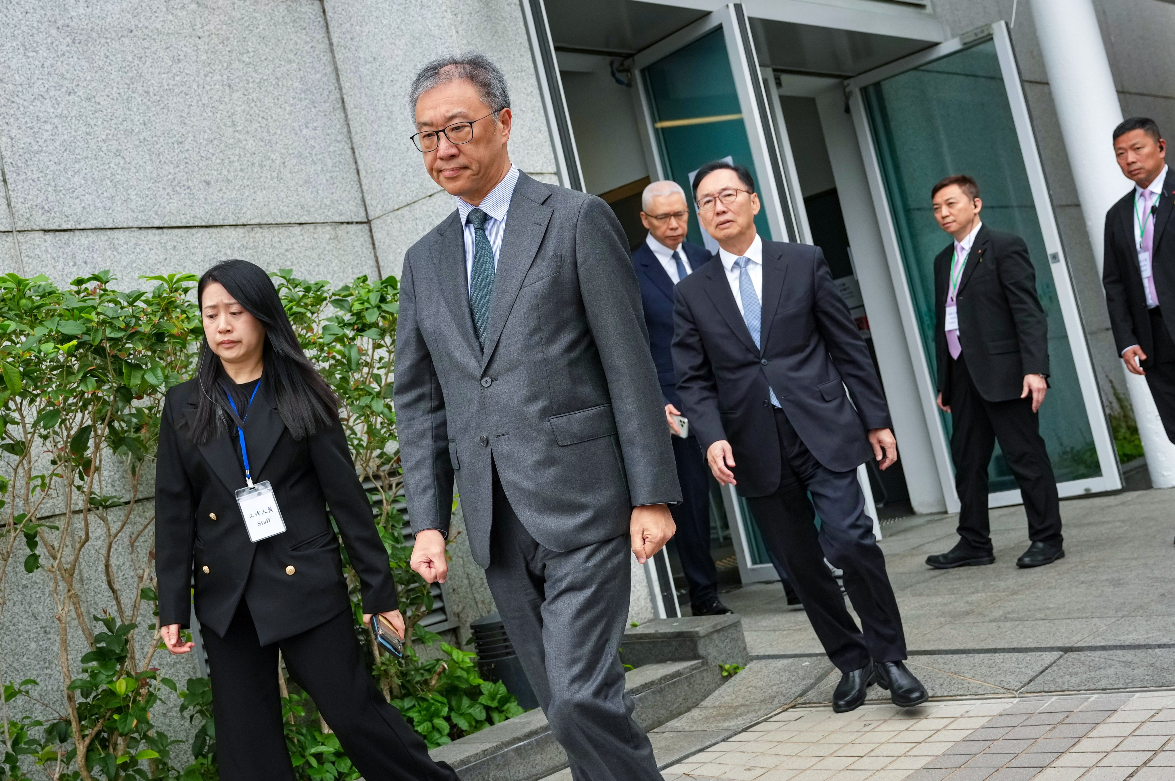 Justice David Lok (centre), leading the independent committee to investigate the Tai Po blaze. Photo: Karma Lo