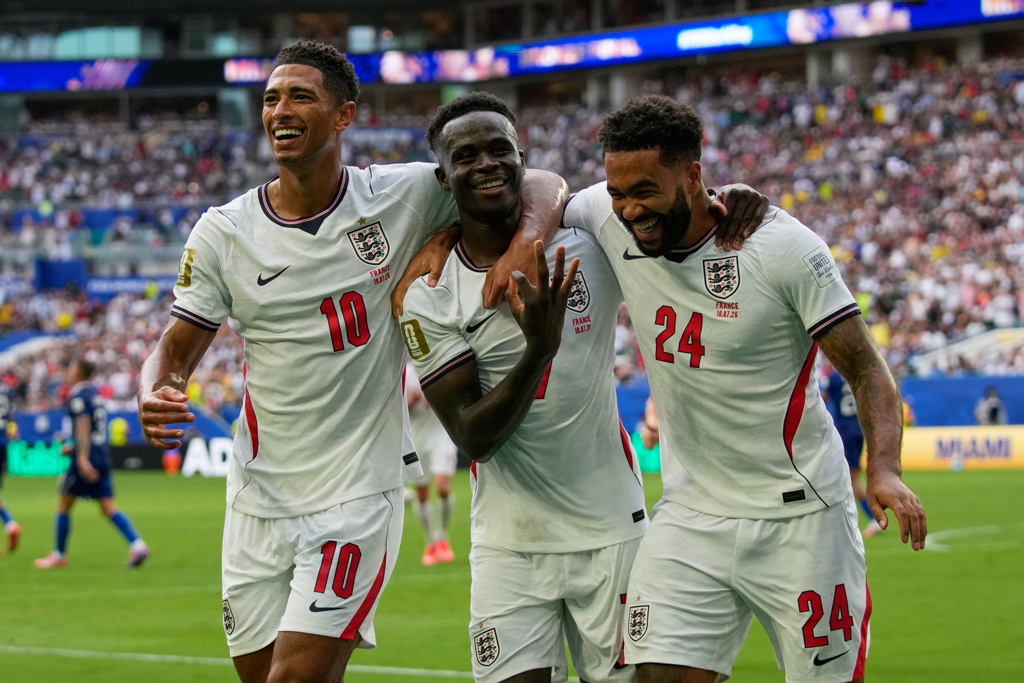 England’s Bukayo Saka (centre) celebrates his hat-trick alongside Jude Bellingham (left) and Reece James. Photo: AP