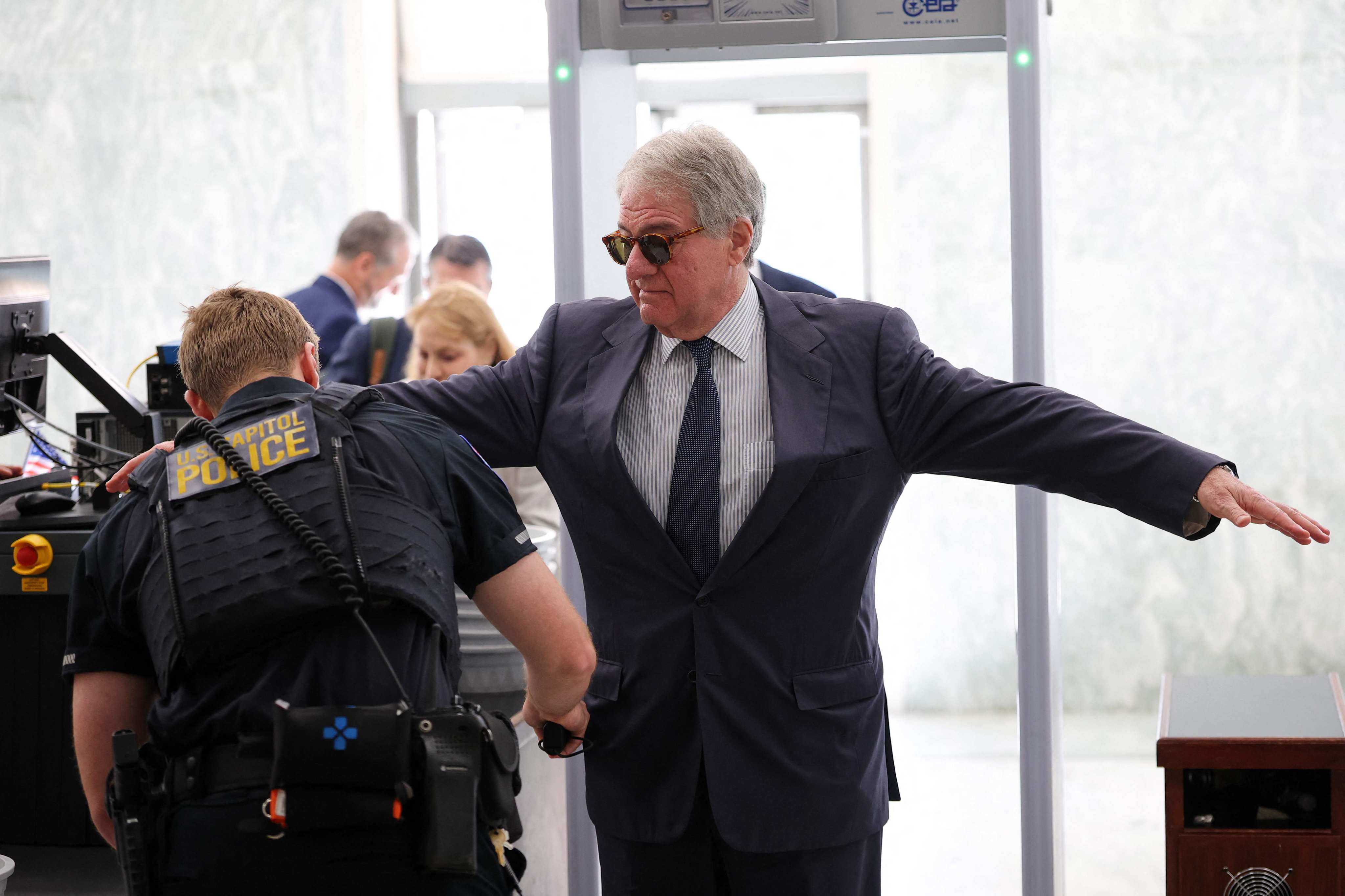 Former CEO of Apollo Global Management Leon Black walks through security as he arrives to testify at a closed-door interview with the House Oversight Committee on Capitol Hill in June. Photo: AFP
