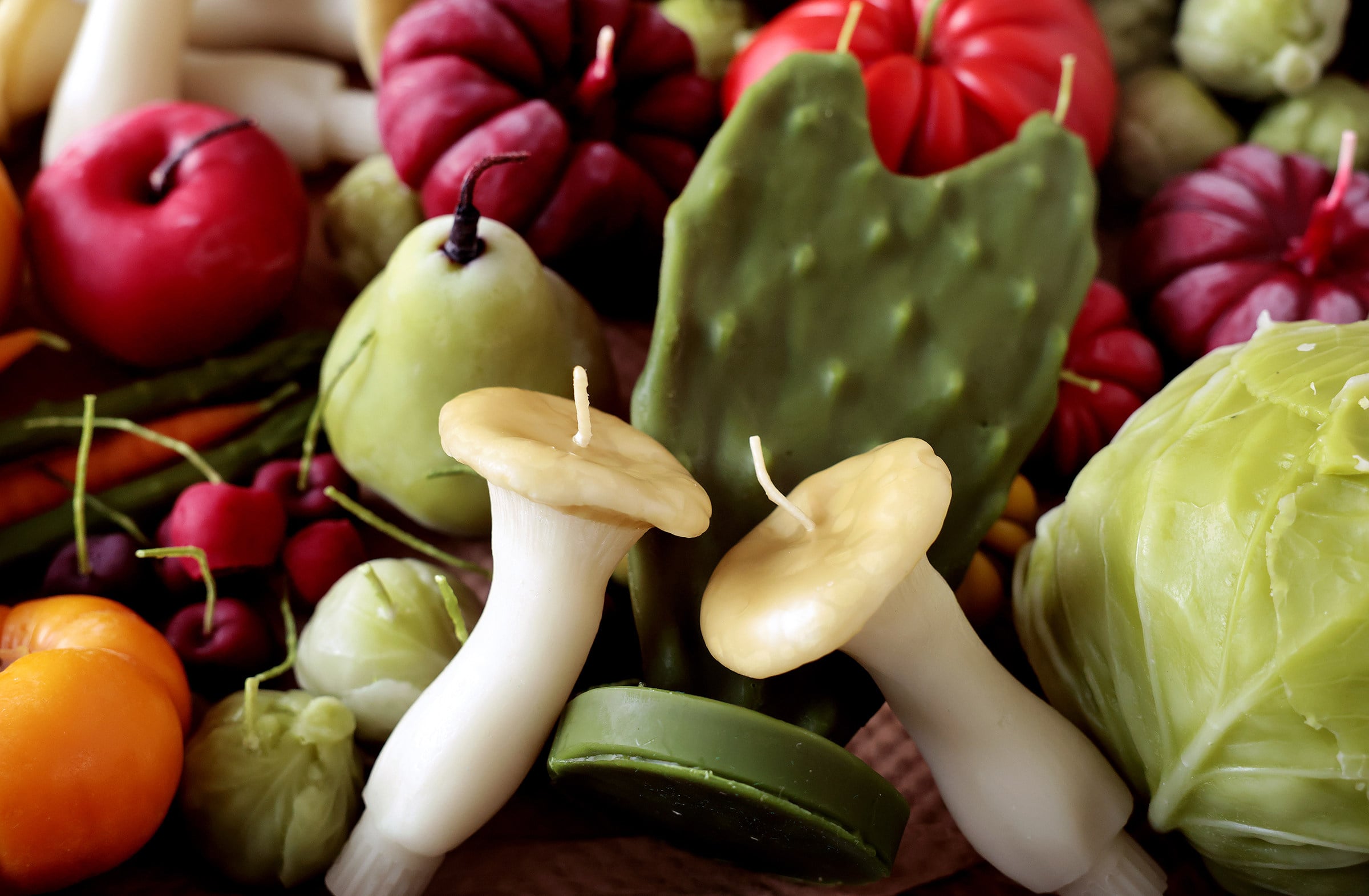 A variety of beeswax candles shaped like fruit and vegetable at Happy Organics’ studio in Los Angeles. The candle collection is a homage by Jessica Gonzalez to her family’s produce company. Photo: TNS
