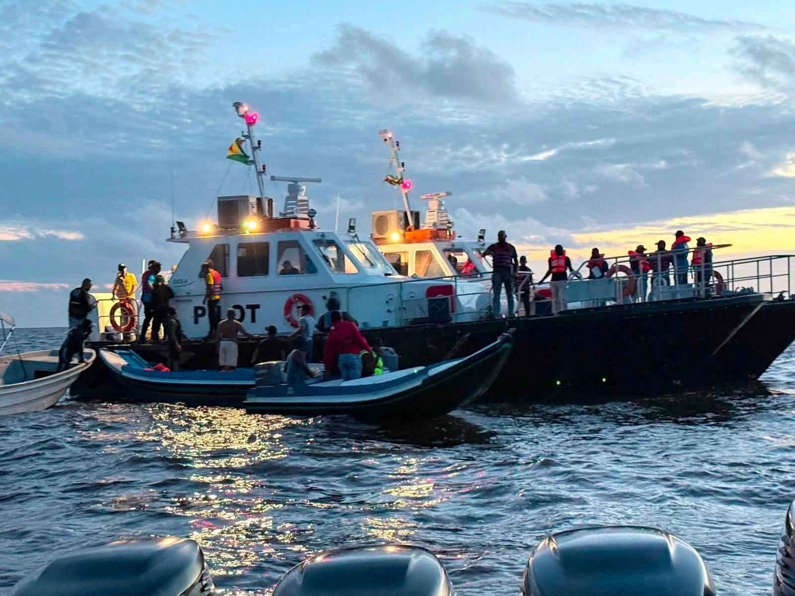 Rescuers look for passengers on Sunday after the MV Barima capsizes off the coast of Guyana. Photo: Handout via Reuters