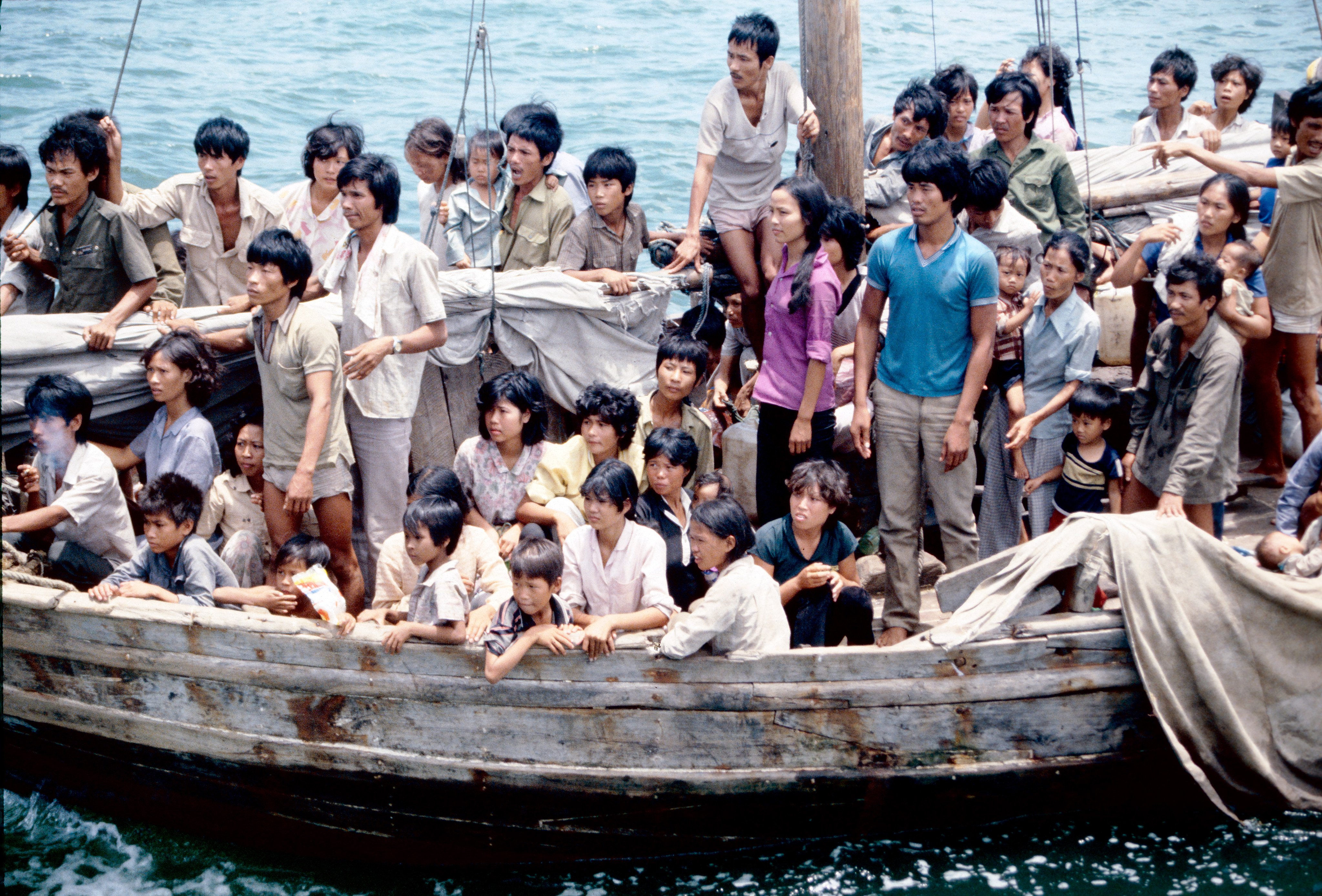 Vietnamese refugees arrive in Hong Kong. Some are wearing the green or khaki shirts of the Vietnamese military. Photo: courtesy of Les Bird