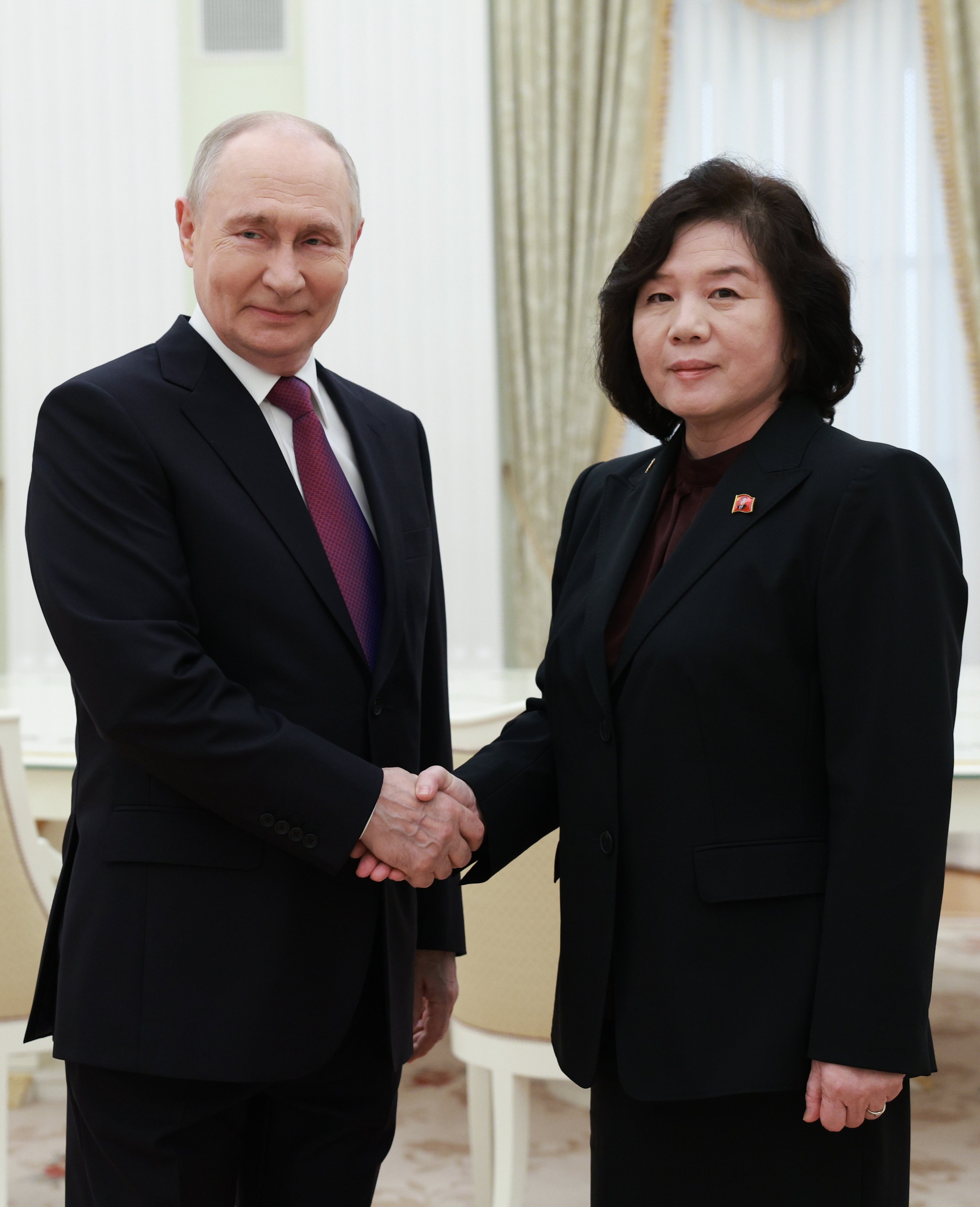 Russian President Vladimir Putin (left) and North Korean Foreign Minister Choe Son-hui shake hands during their meeting in Moscow on Sunday. Photo: Kremlin/Sputnik/EPA