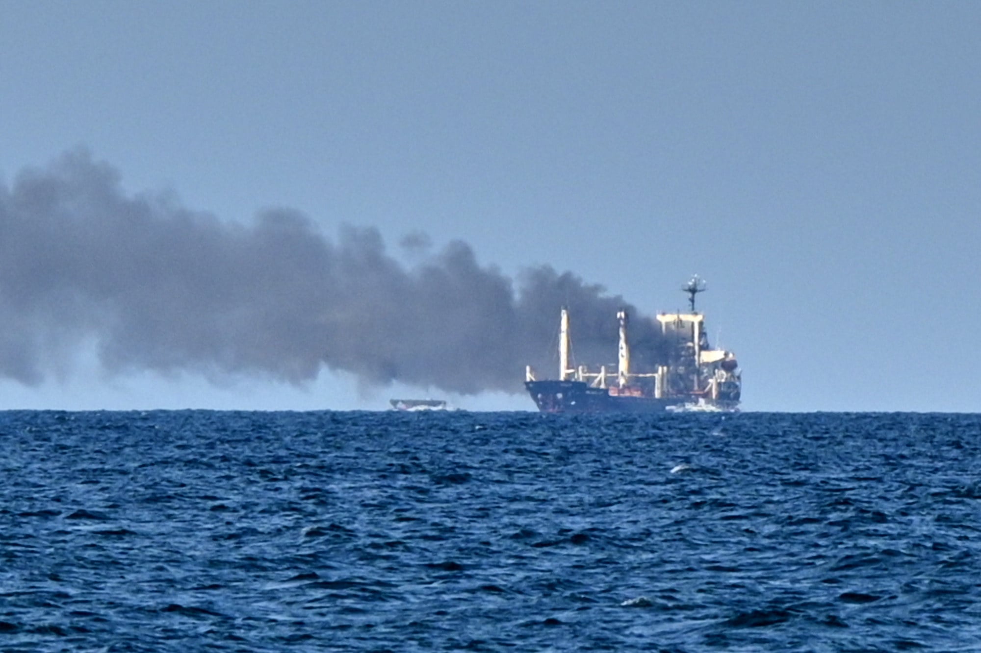 Smoke rises from the grain carrier Golden Leo under the Guinea-Bissau flag after Russian missile strikes in the the Black Sea close to Odesa, Ukraine on Sunday. Photo: AP