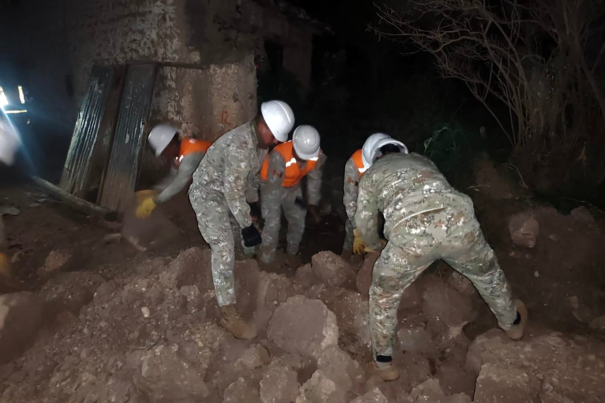 First responders in Peru search through collapsed houses on the outskirts of Huancayo, east of Lima in Junin Department on Sunday following an earthquake. Photo: Handout / Peruvian Ministry of Defence / AFP