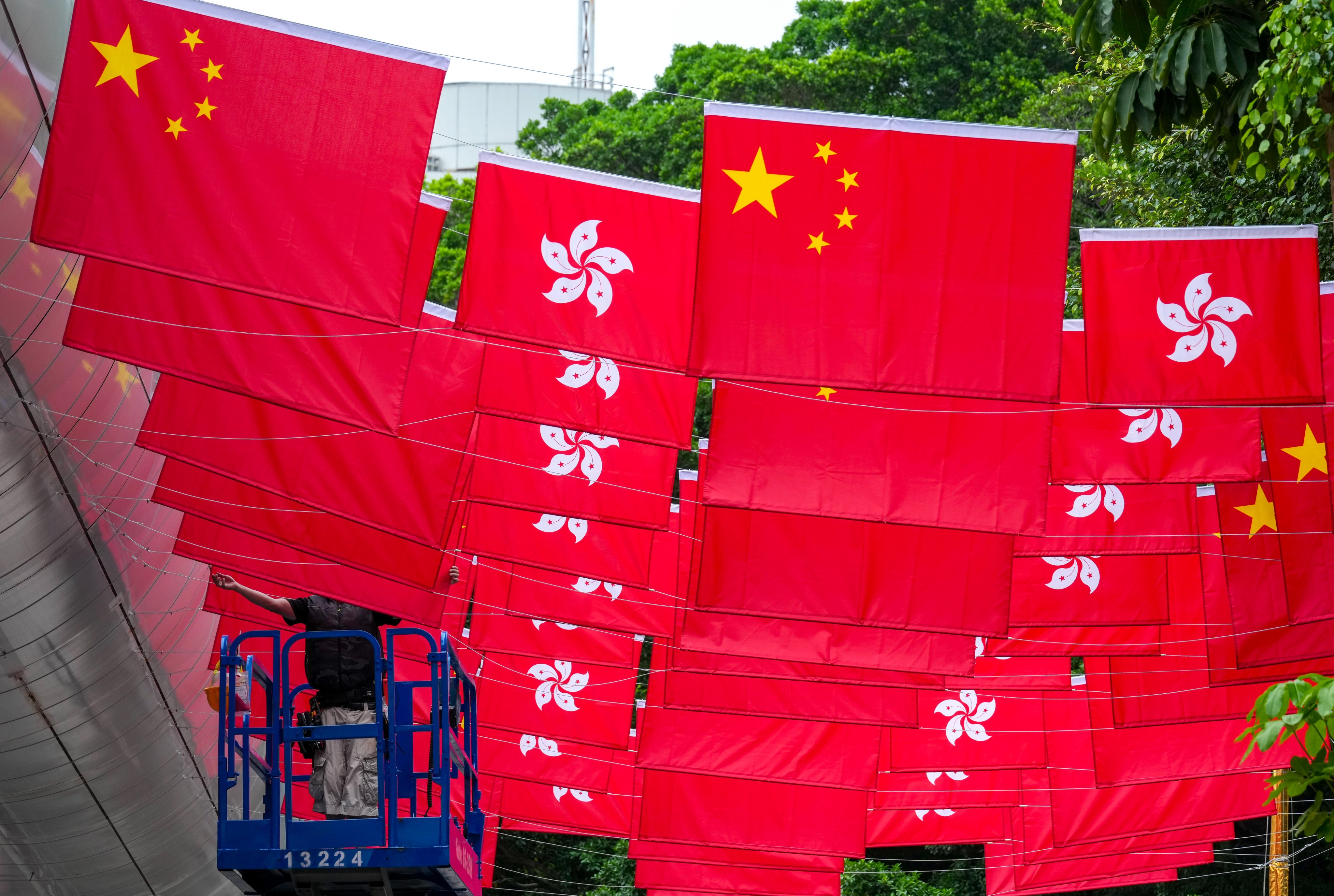 National and Hong Kong flags line Park Lane Shopper’s Boulevard in Tsim Sha Tsui, ahead of the 29th anniversary of city's return to Chinese sovereignty on July 1. Photo: Jelly Tse