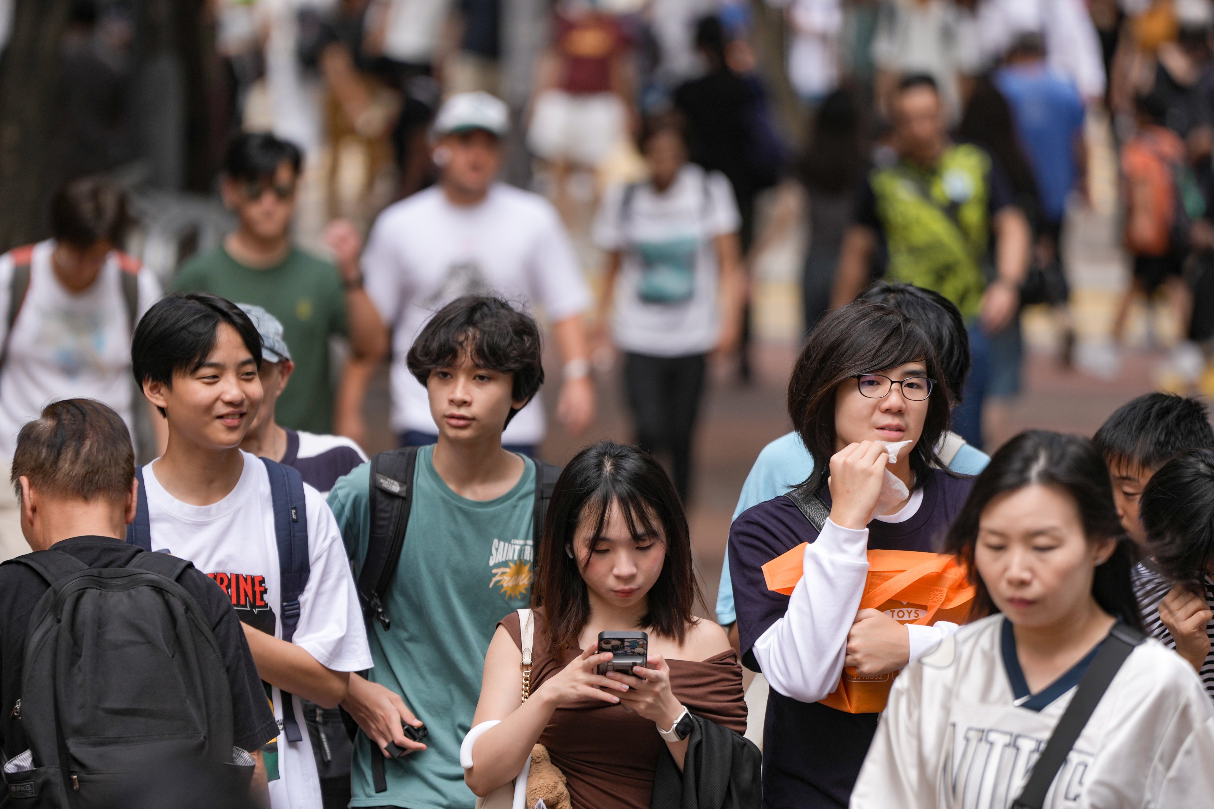 Young people on a street in Causeway Bay. The QS ranking provides an overview of the best places to live and study around the world for international students. Photo: Sam Tsang