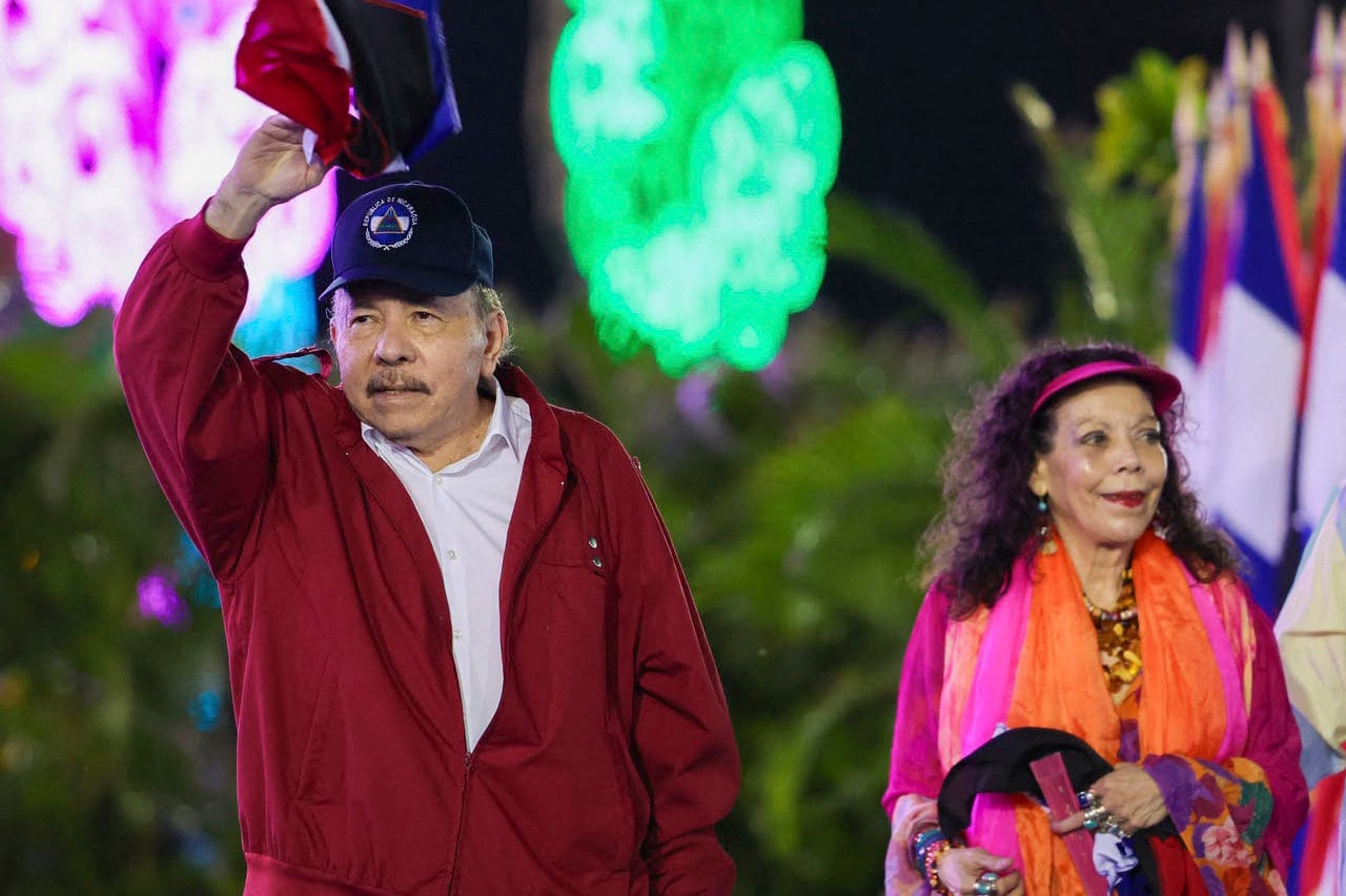 Nicaragua’s President Daniel Ortega waving next to wife and co-President Rosario Murillo. Photo: EL 19 DIGITAL via AFP