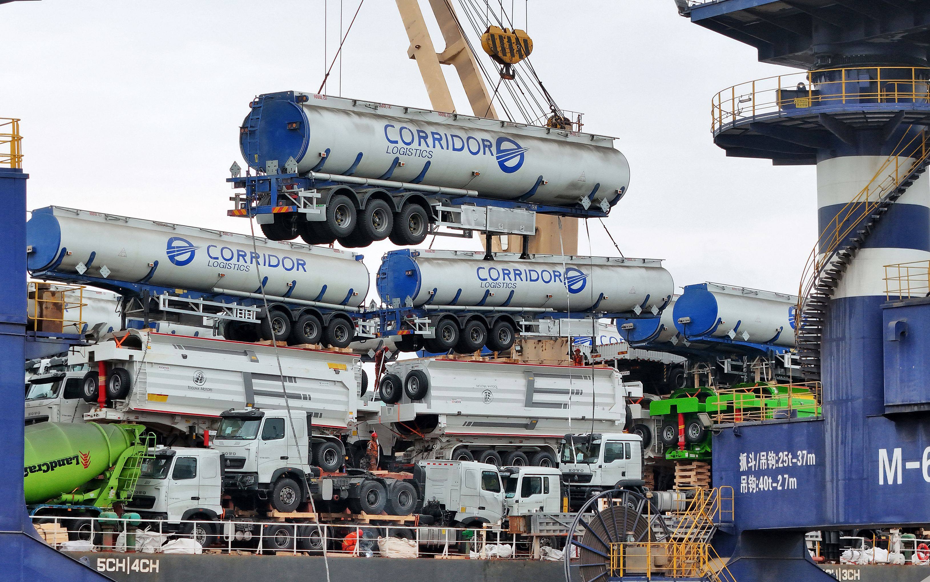 Fuel tankers are loaded onto a ship for export to Mali at the port in Yantai, in China’s eastern Shandong province on May 18. Photo: AFP
