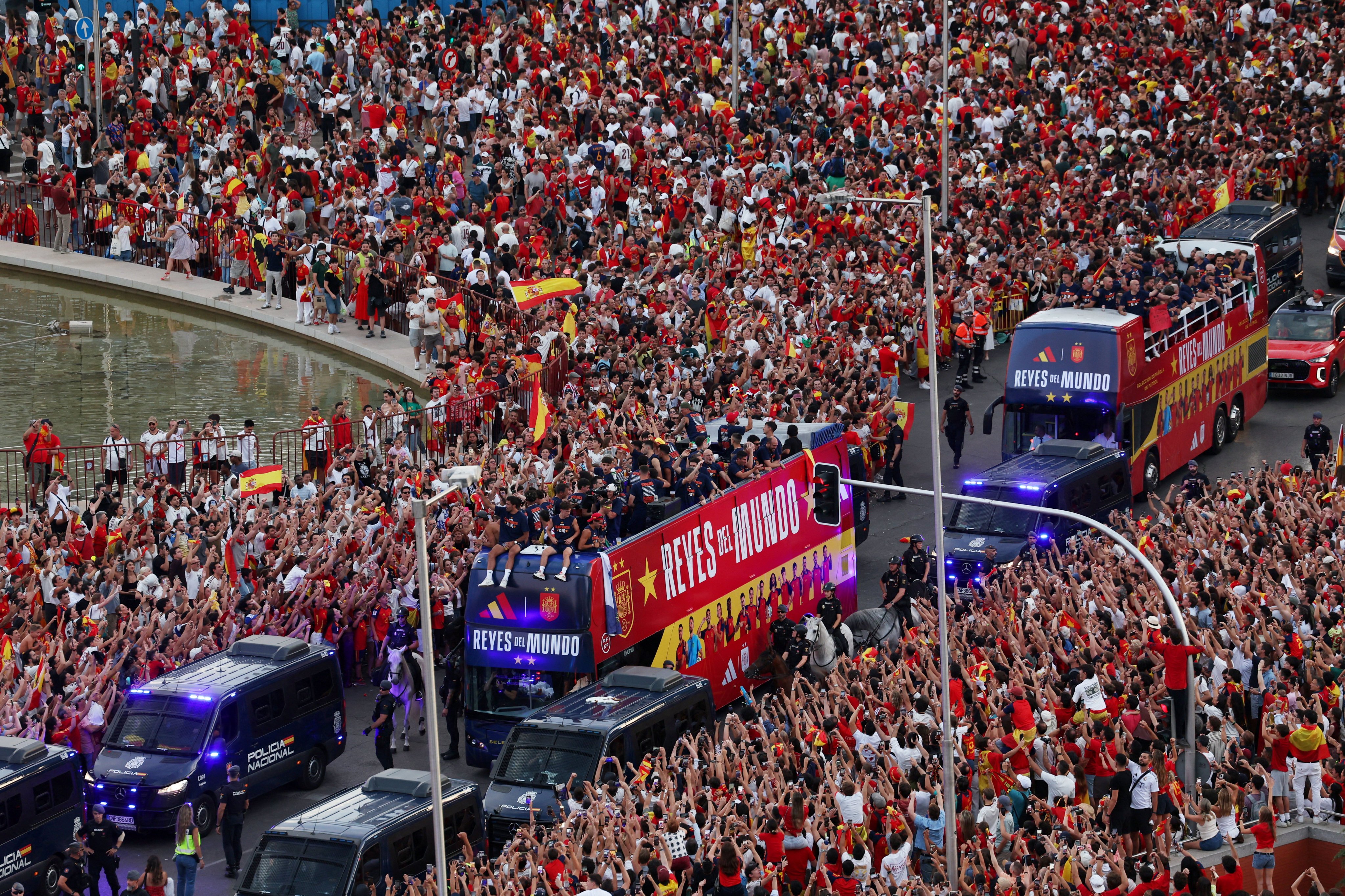 Spain players on buses during the World Cup victory parade through the streets of Madrid on Monday. Photo: Reuters