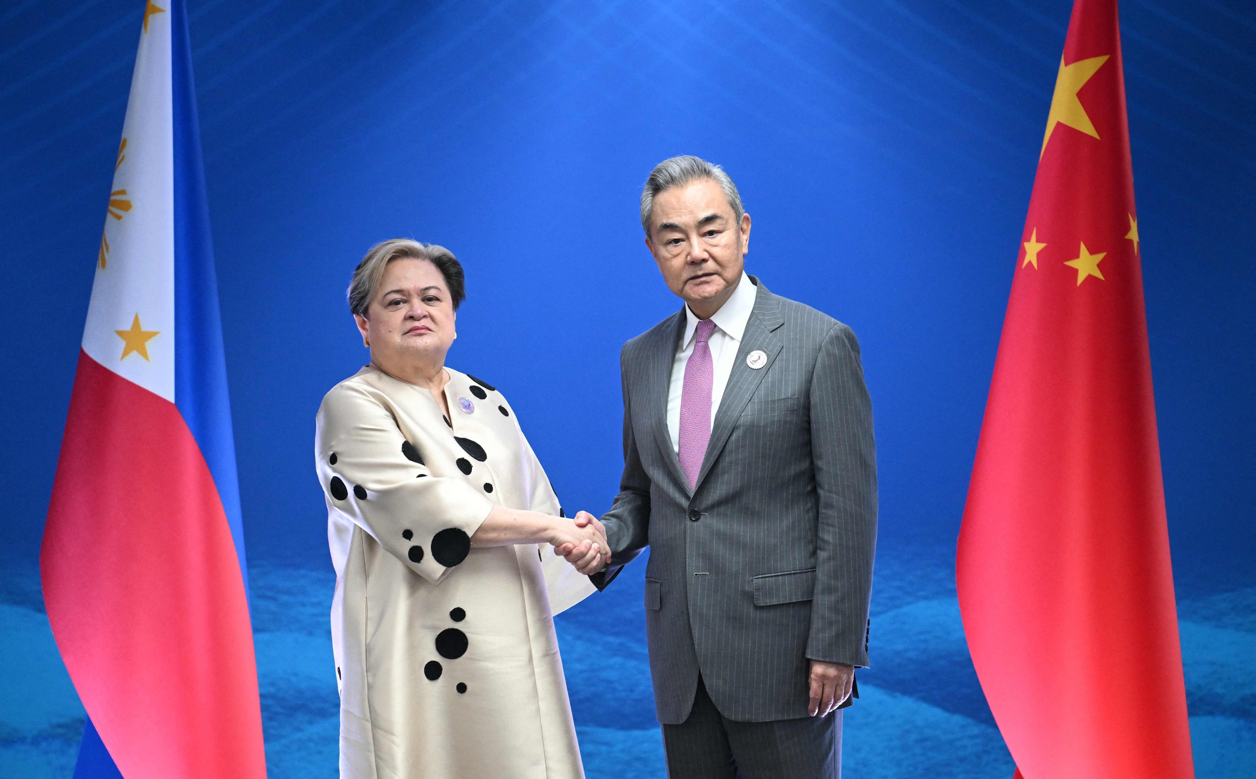 Philippine Foreign Secretary Maria Theresa Lazaro with Chinese Foreign Minister Wang Yi on the sidelines of the Asean foreign ministers’ meeting in Manila on Wednesday. Photo: AFP