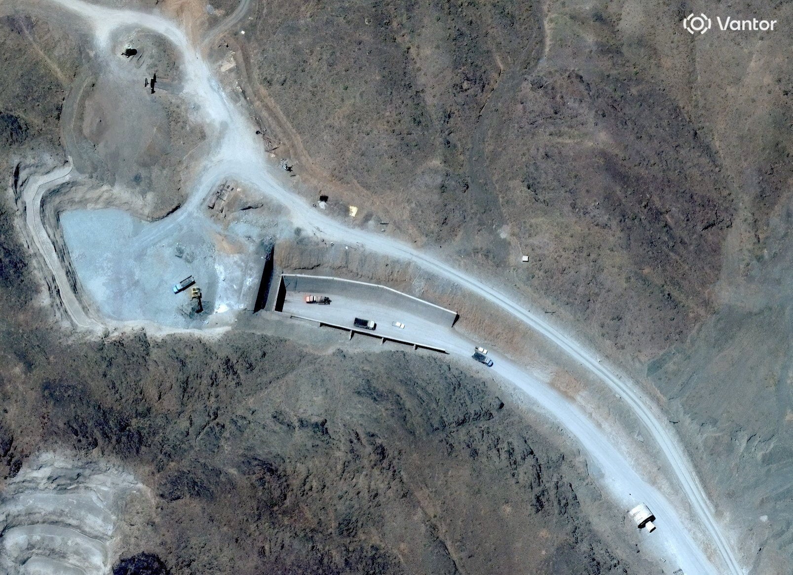 A satellite view shows vehicles at an entrance to Pickaxe Mountain tunnels near Iran's Natanz nuclear facility. Photo: Vantor via Reuters