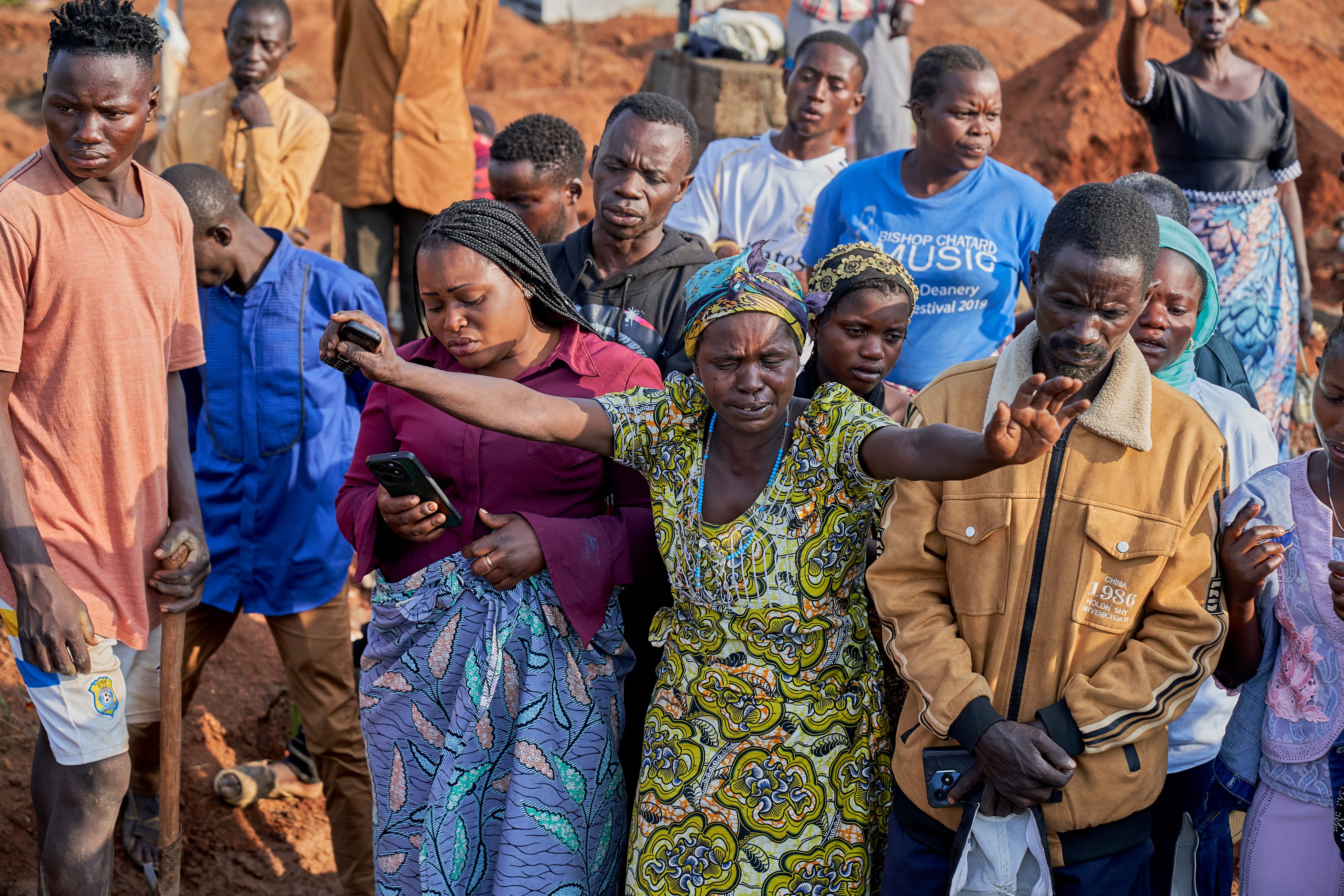 Relatives of Ebola victims react during a burial ceremony at a cemetery in Bunia, Ituri province, Democratic Republic of Congo on 22 July. Photo: EPA
