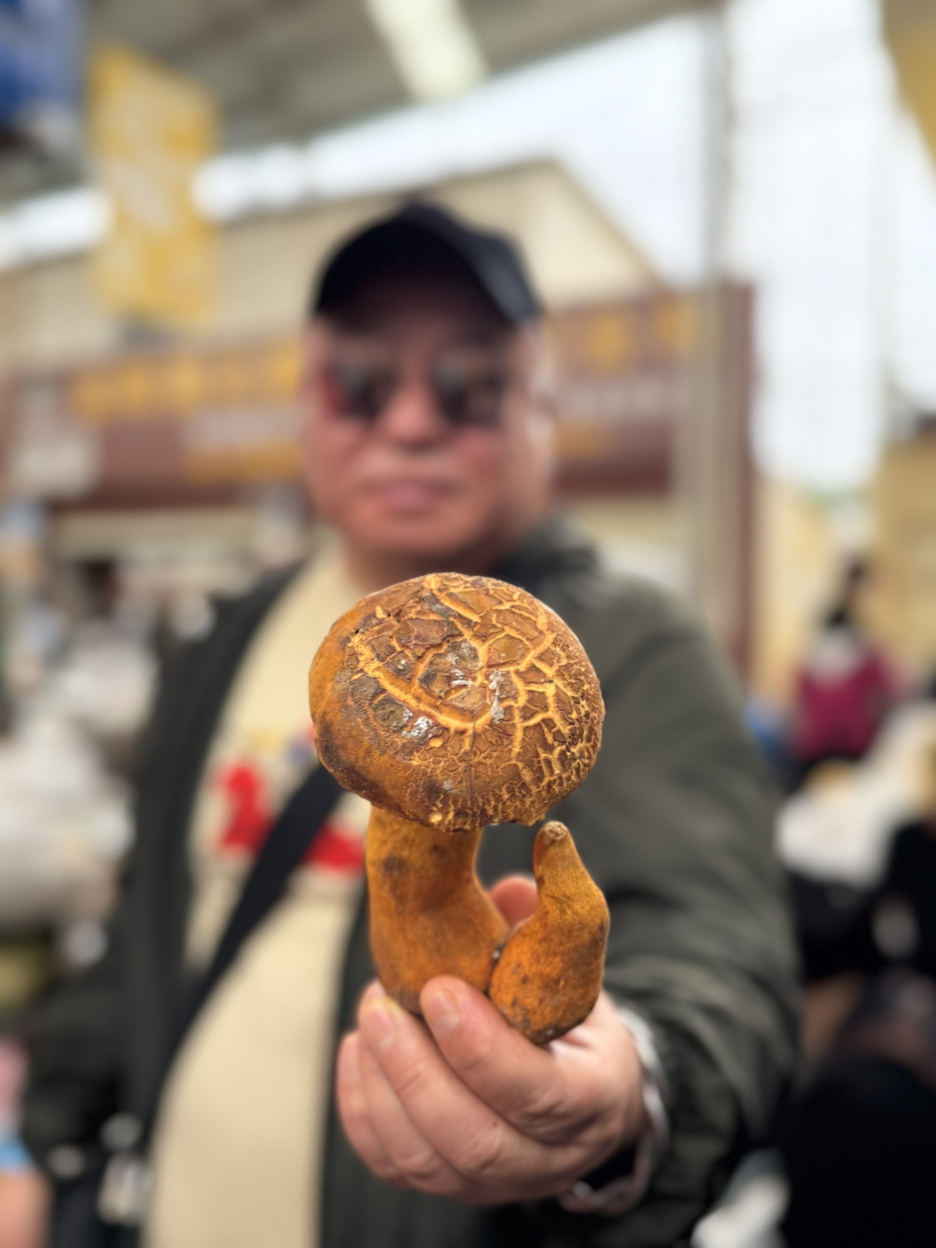 Liu Xin, chef-owner of Yunnan restaurant Hong 0871, holds a yellow bolete mushroom. He says there are more than 1,000 species of edible wild mushrooms in Yunnan, China. Photo: Evelyn Chen