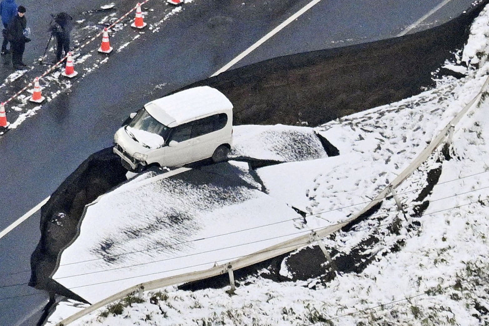 A collapsed road in Tohoku in Aomori prefecture, Japan, following a strong earthquake that struck the region in December last year. Photo: Kyodo/Reuters