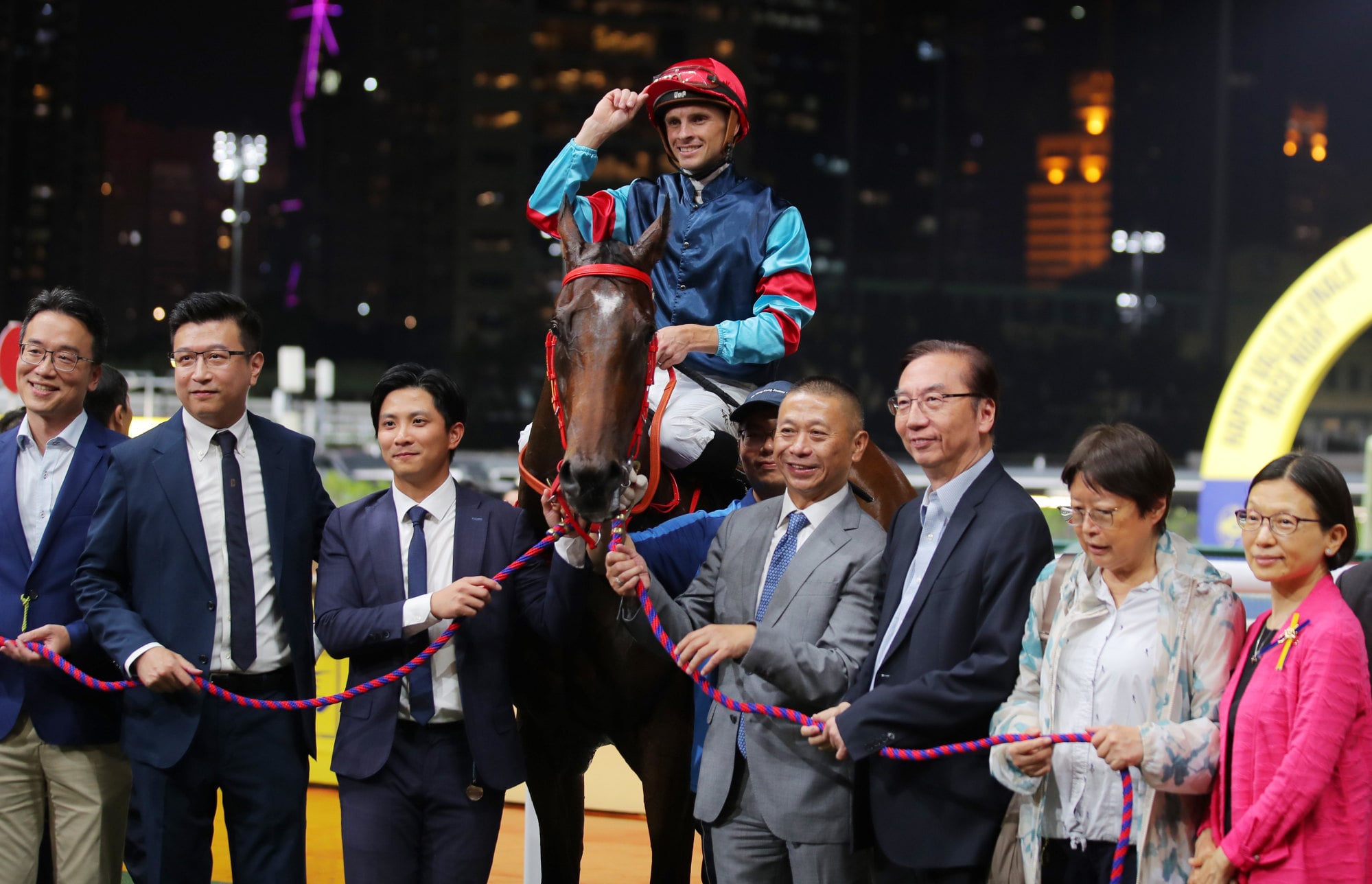 Lyle Hewitson celebrates with connections after piloting Winning Champion to victory at the Happy Valley season finale. Lyle Hewitson celebrates with connections after piloting Winning Champion to victory at the Happy Valley season finale.