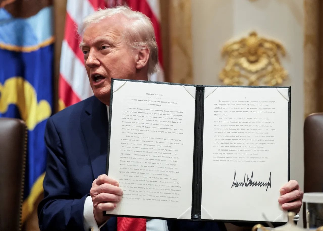 US President Donald Trump displays an executive order launching the AI-focused Genesis Mission on November 24, 2025. Photo: Reuters