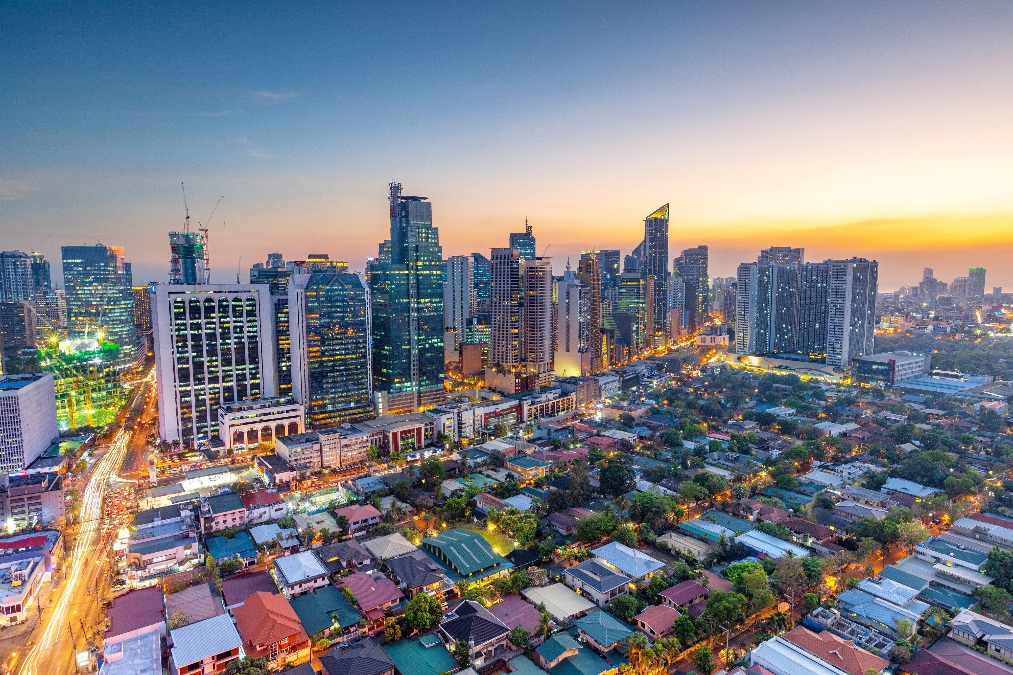 Makati, the business district of Metro Manila, lights up as night falls. Photo: Shutterstock