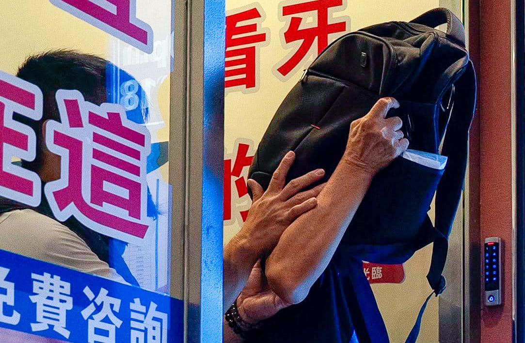 Law enforcement officers arrest a man from the consultation centre. Photo: Handout