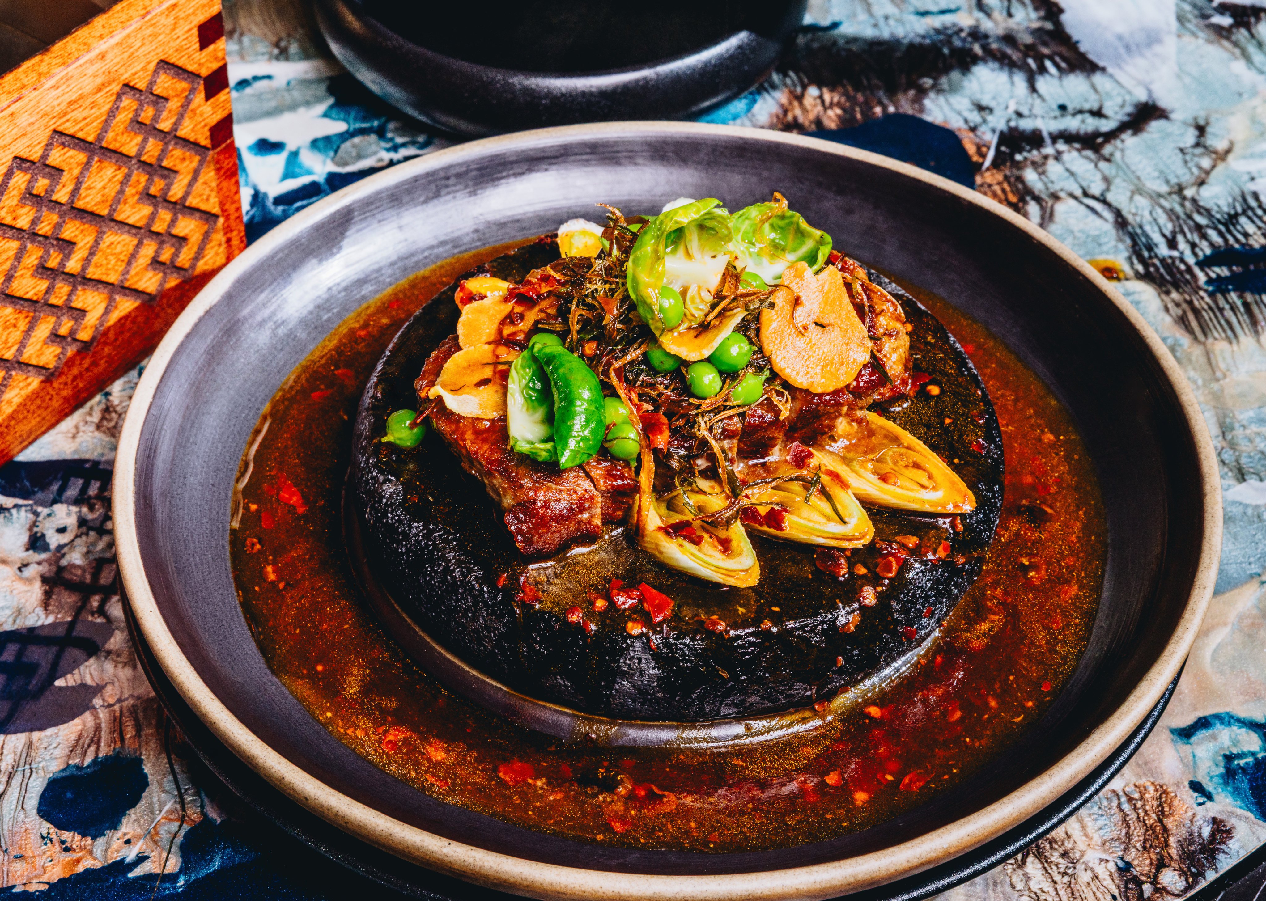 Japanese Kobe beef A5+ with grilled leeks and home-made black bean paste at Mott 32. Photo: Jocelyn Tam