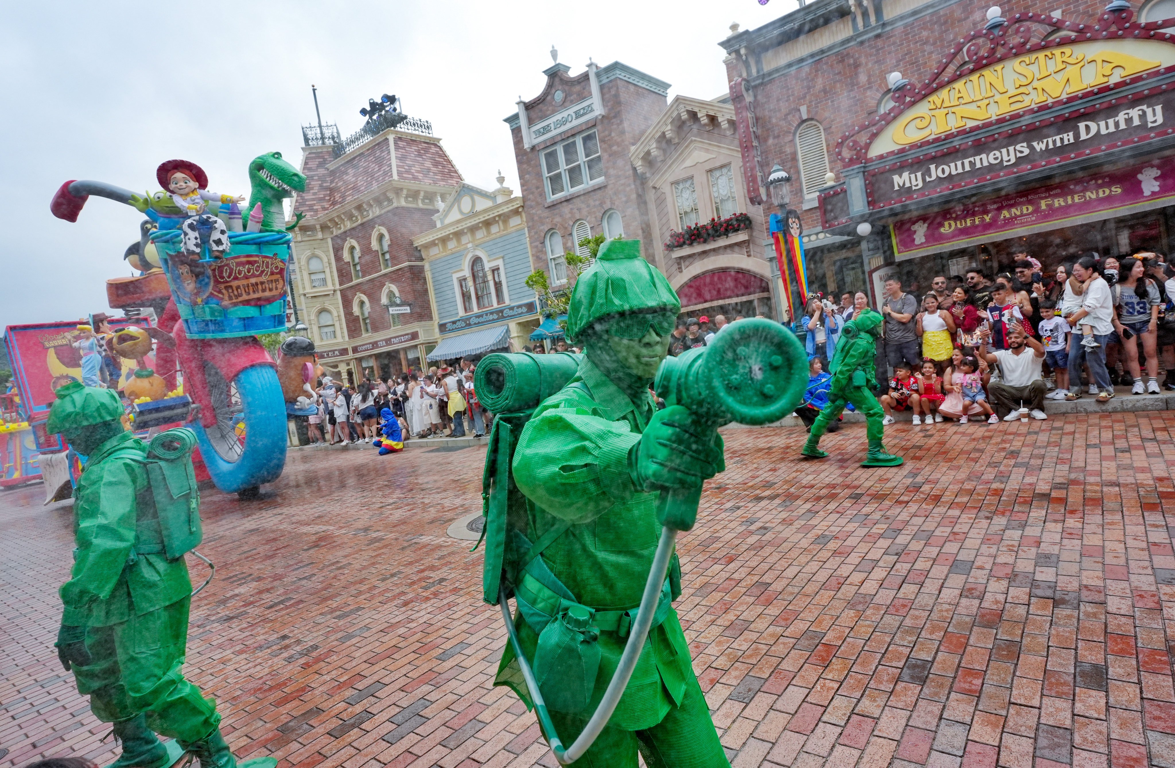 Visitors get into the spirit of the Pixar water play street party. Photo: Elson Li