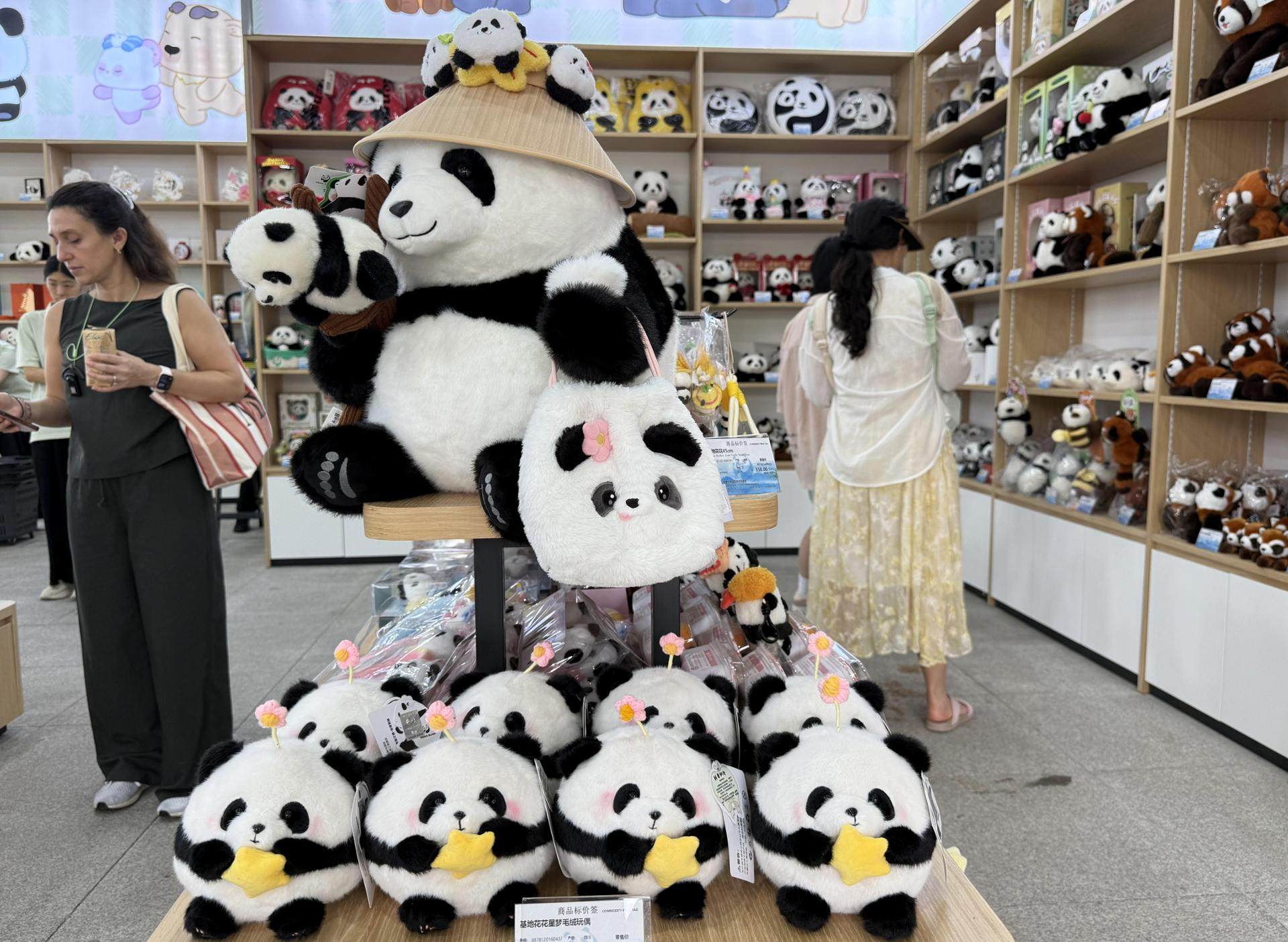 Stuffed panda dolls inspired by Hua Hua, the most popular panda living at the Chengdu Research Base of Giant Panda Breeding in China, are displayed at a gift shop at the research base. Photo: The Korea Times