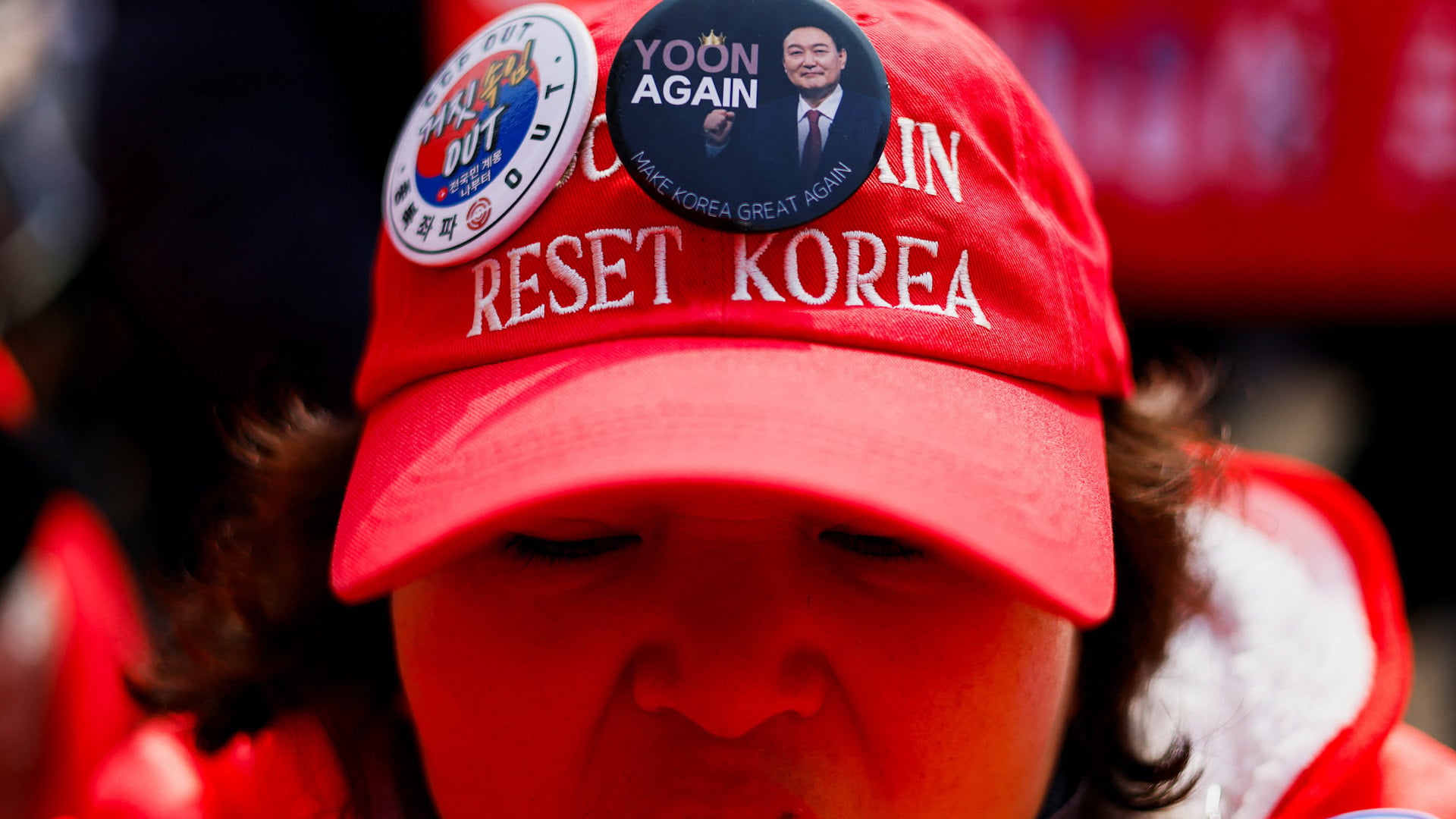 A pro-Yoon supporter chants slogans at a protest in Seoul.