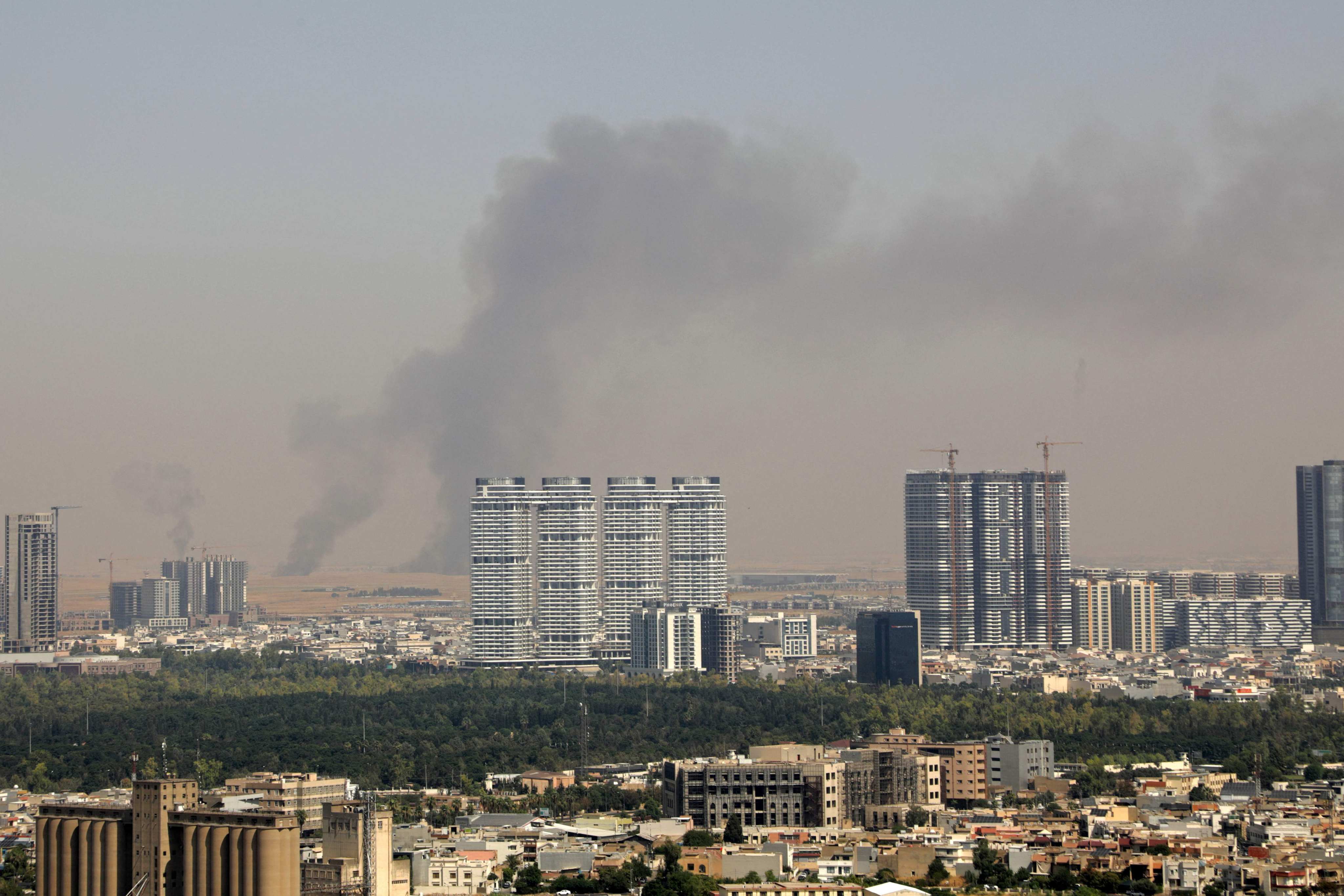 Smoke rises after explosions were heard near the airport in the city of Erbil, on Friday. The area hosts US-led coalition troops in Iraq’s semi-autonomous Kurdistan region. Photo: AFP