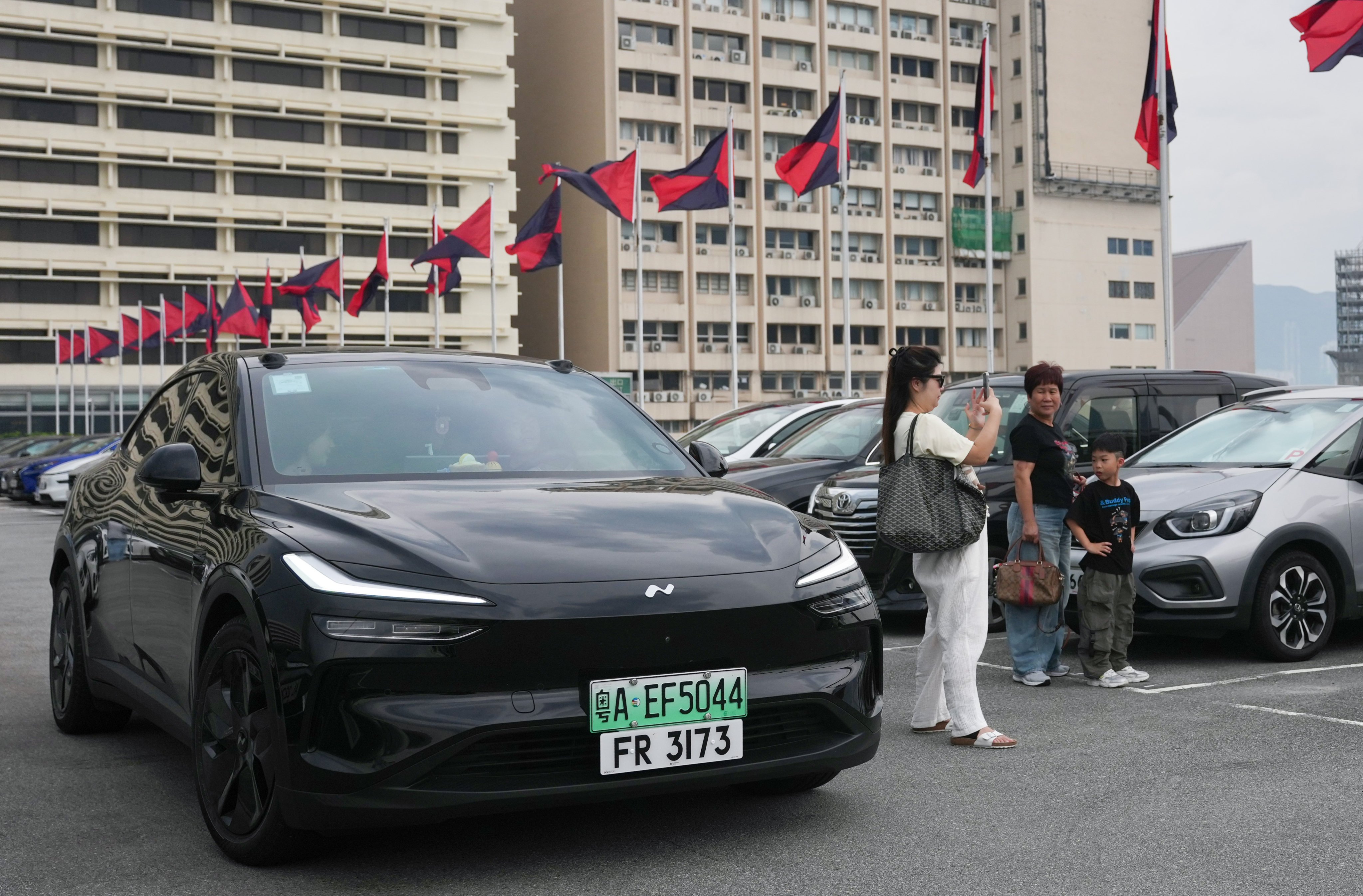 A car travelling under the expanded Southbound Travel for Guangdong Vehicles scheme at Ocean Terminal carpark on Saturday. Photo: Karma Lo